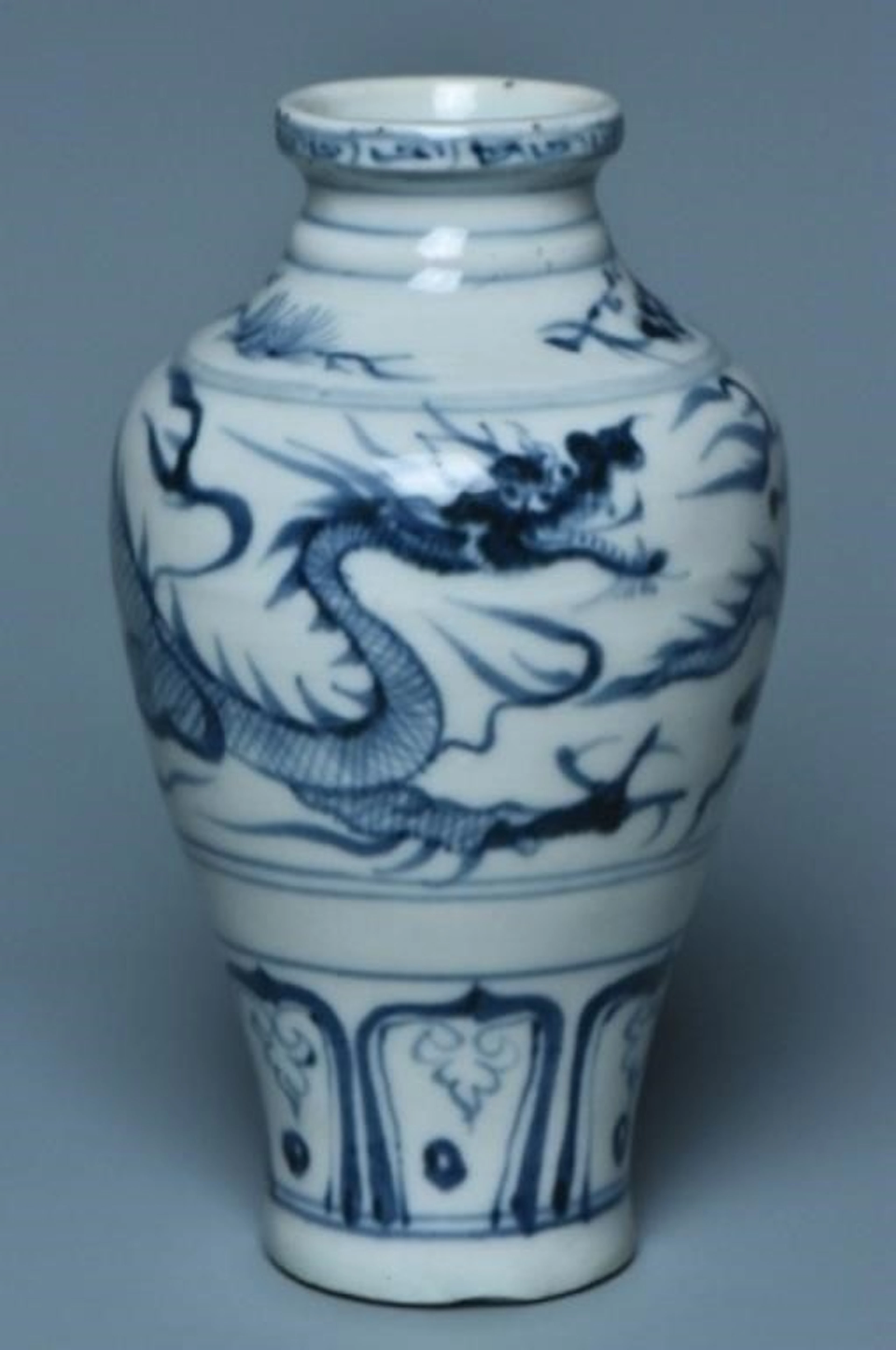 A YUAN DYNASTY BLUE AND WHITE DRAGON VASE
