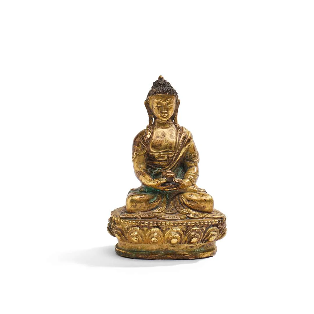 TIBET, A gilded bronze statuette of the Buddha, depicted seated in