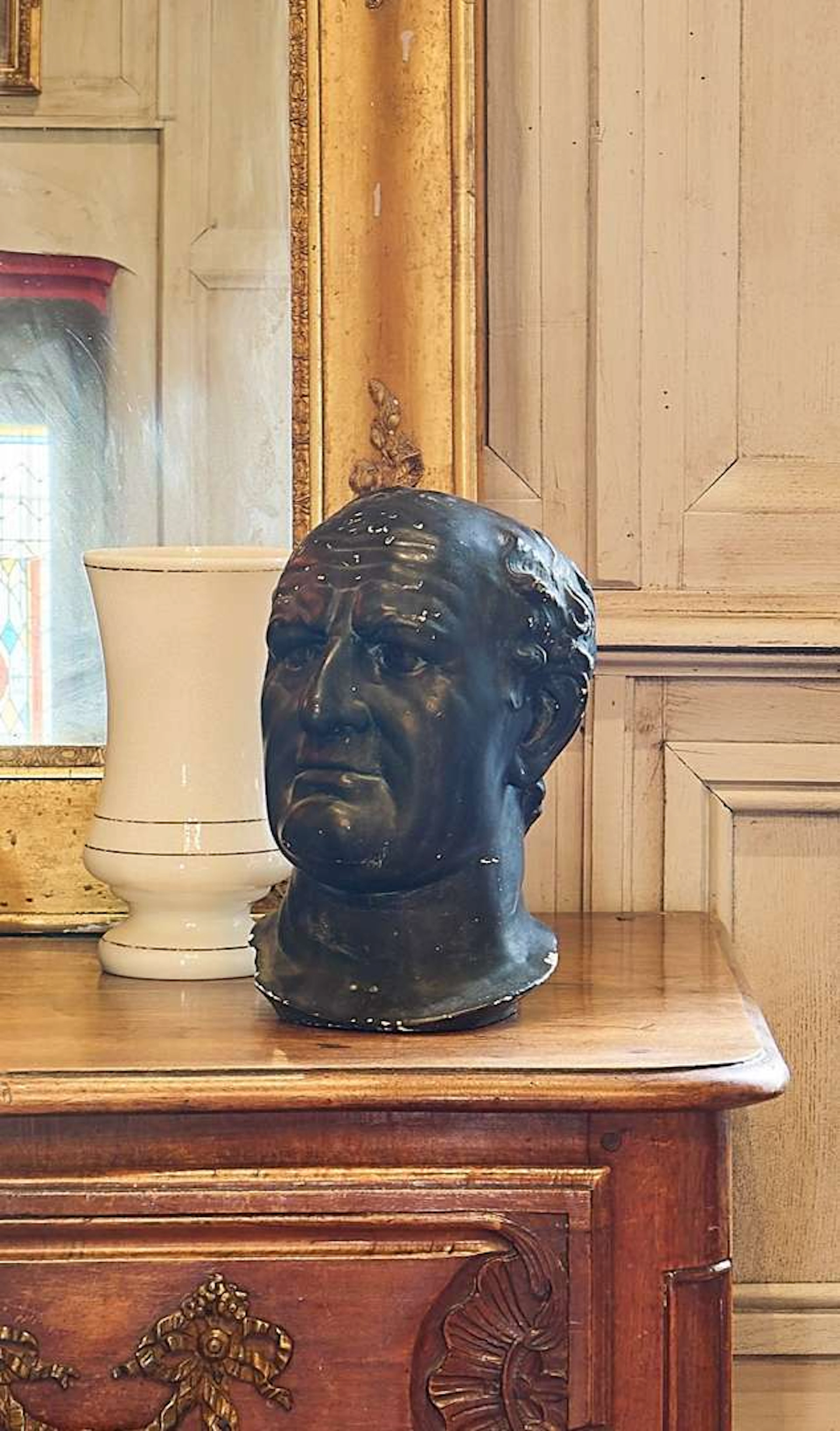 Two men's heads, made of blackened plaster to resemble bronze