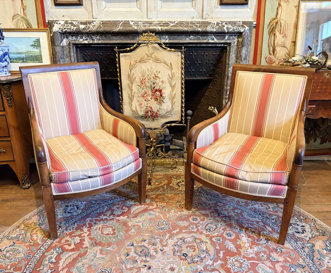 A pair of wing chairs, made of wood