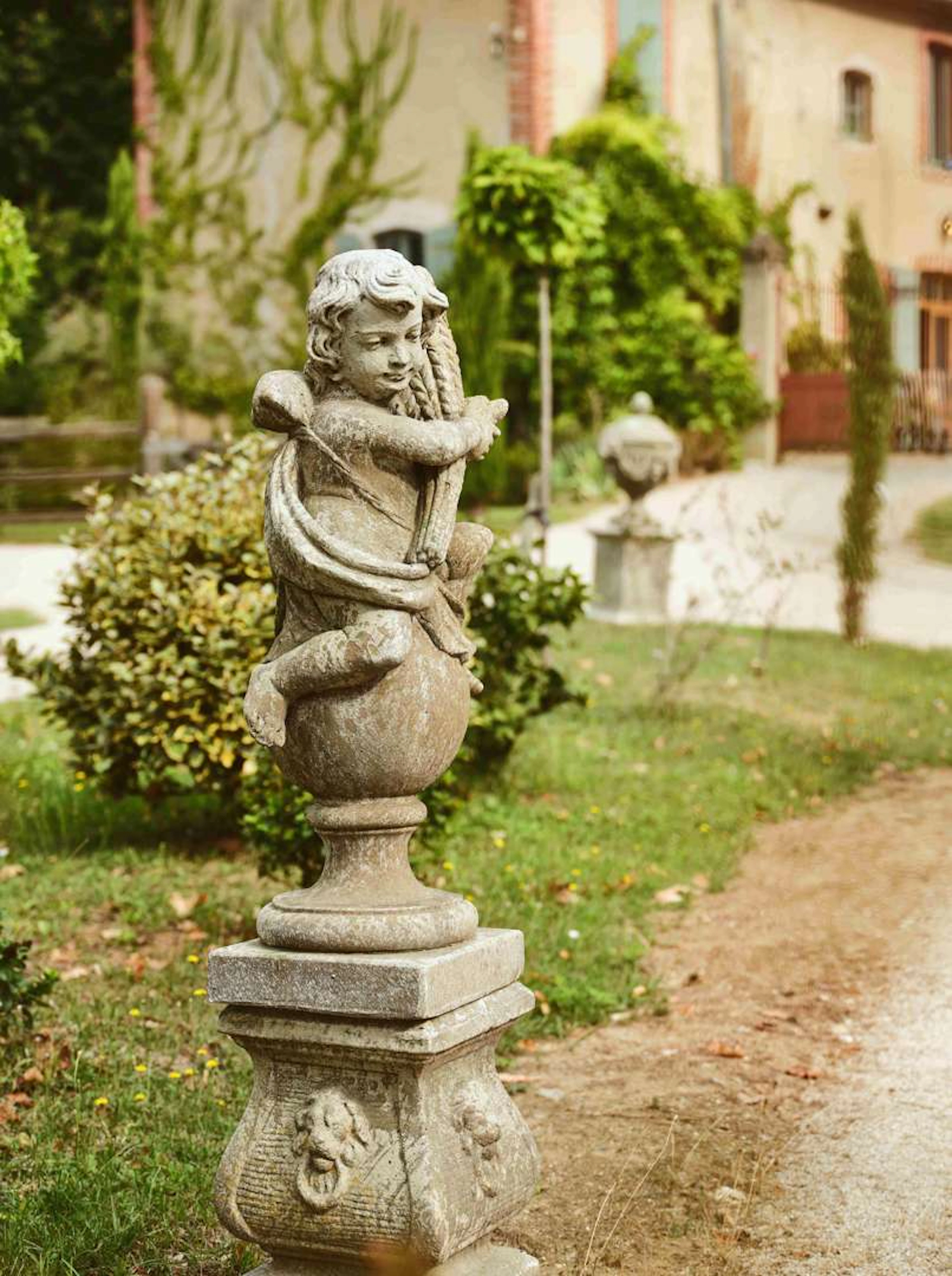 The Four Seasons, Putti sculptures made from imitation reconstituted stone