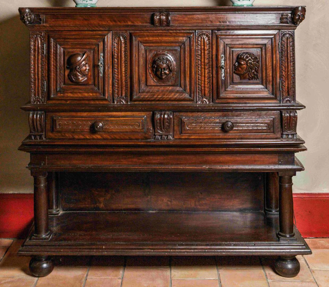 Sideboard, made of carved and moulded wood, in two sections