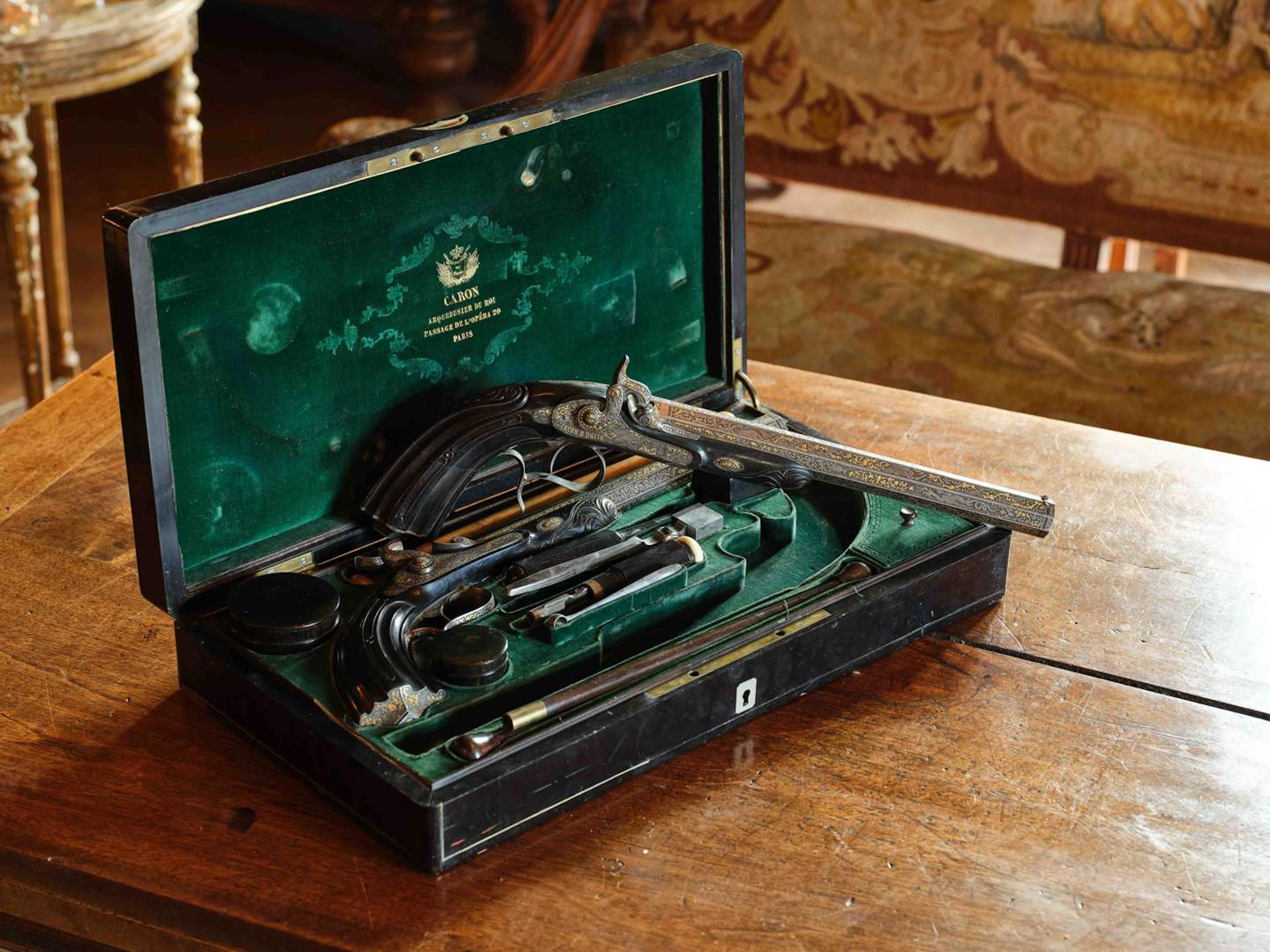 CARON, the King’s arquebusier, A pair of duelling pistols in a case