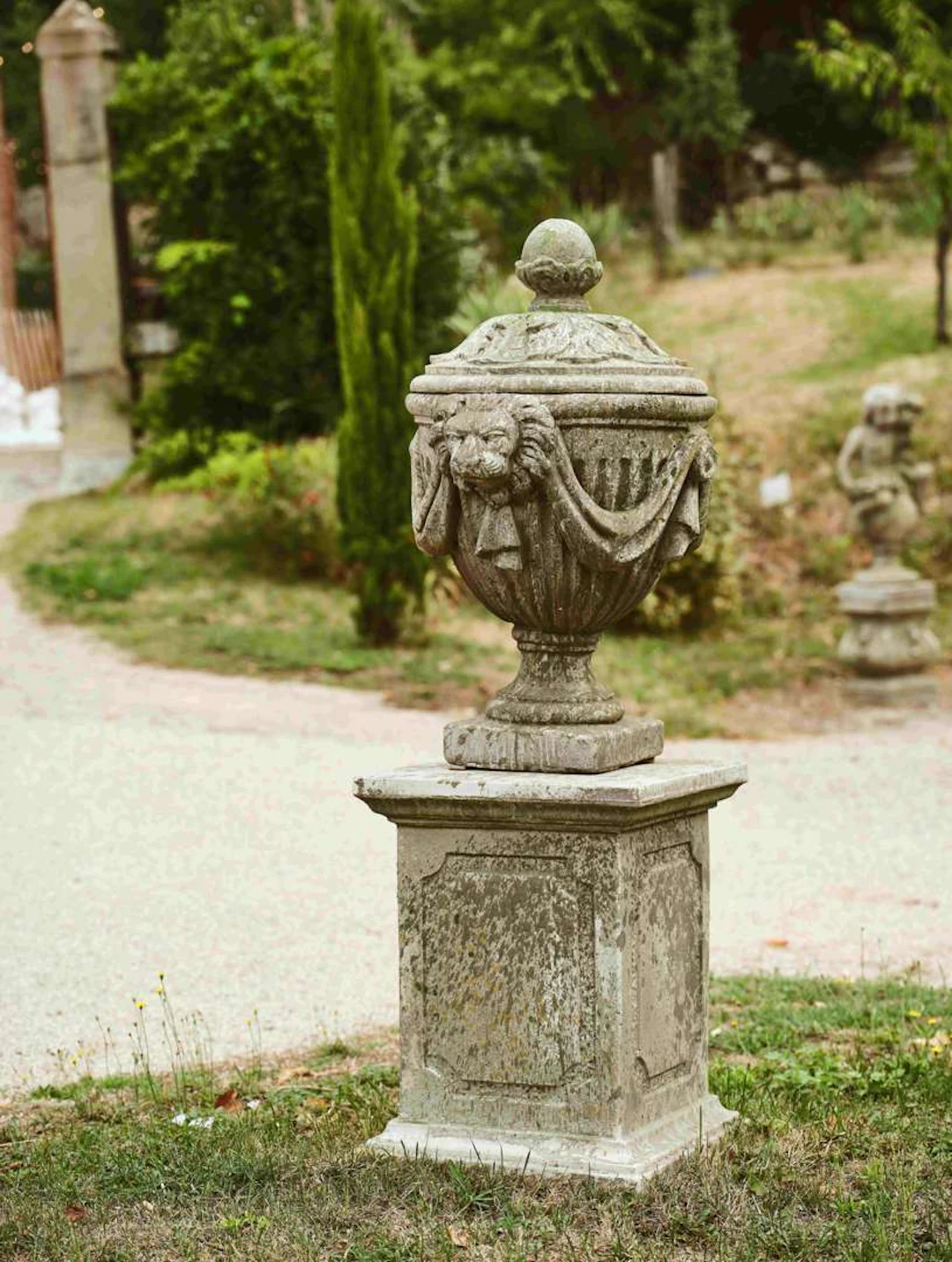 Pair of lidded pots, in imitation reconstituted stone