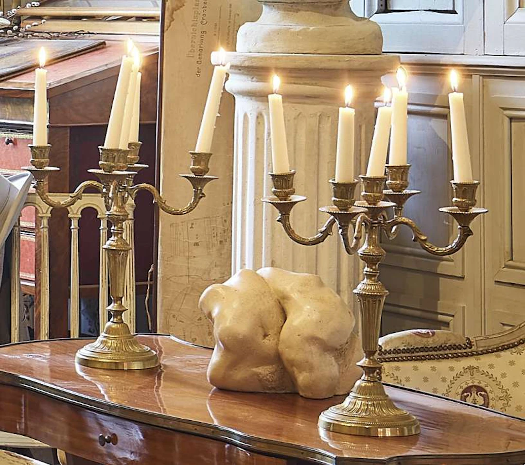 Pair of candlesticks, in gilded bronze with four light arms