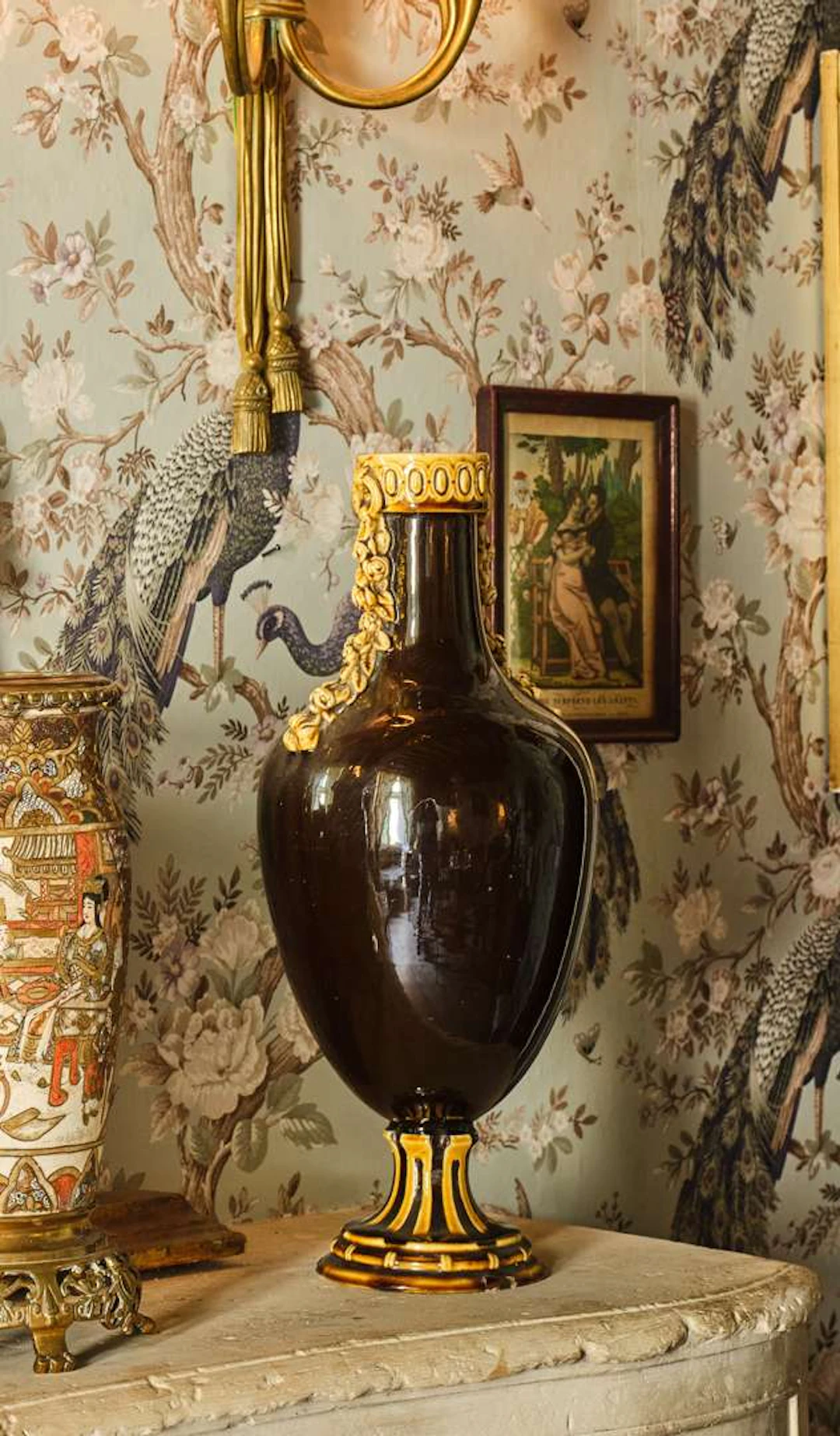 A pair of baluster vases, made of black and yellow glazed ceramic