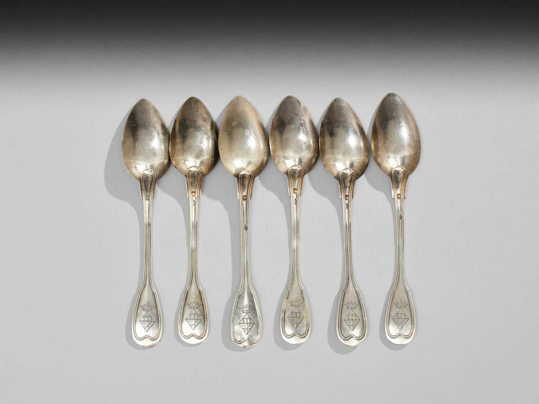 SIX SMALL SPOONS WITH WEAPONS