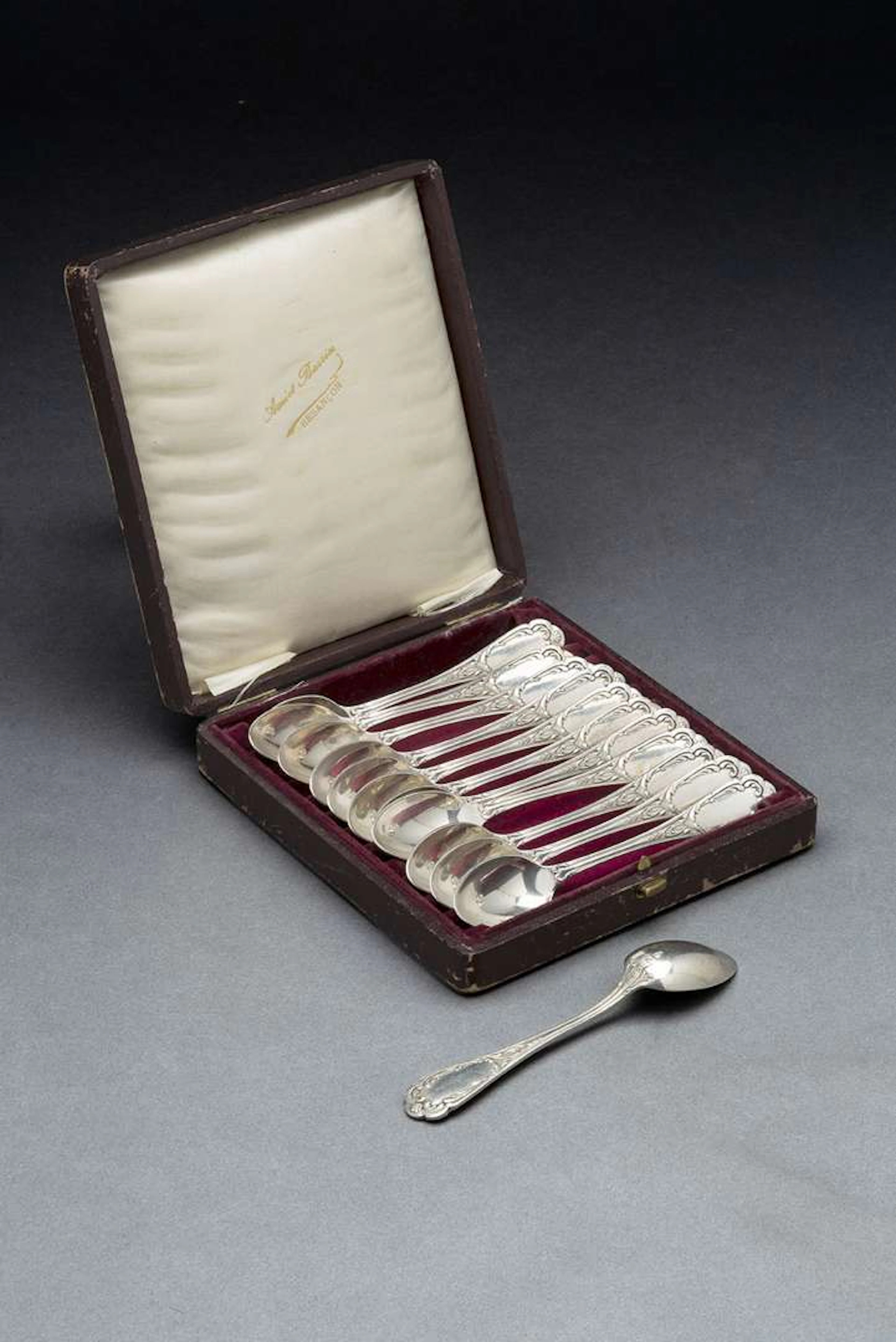 ERCUIS, A set of twelve silver-plated dessert spoons