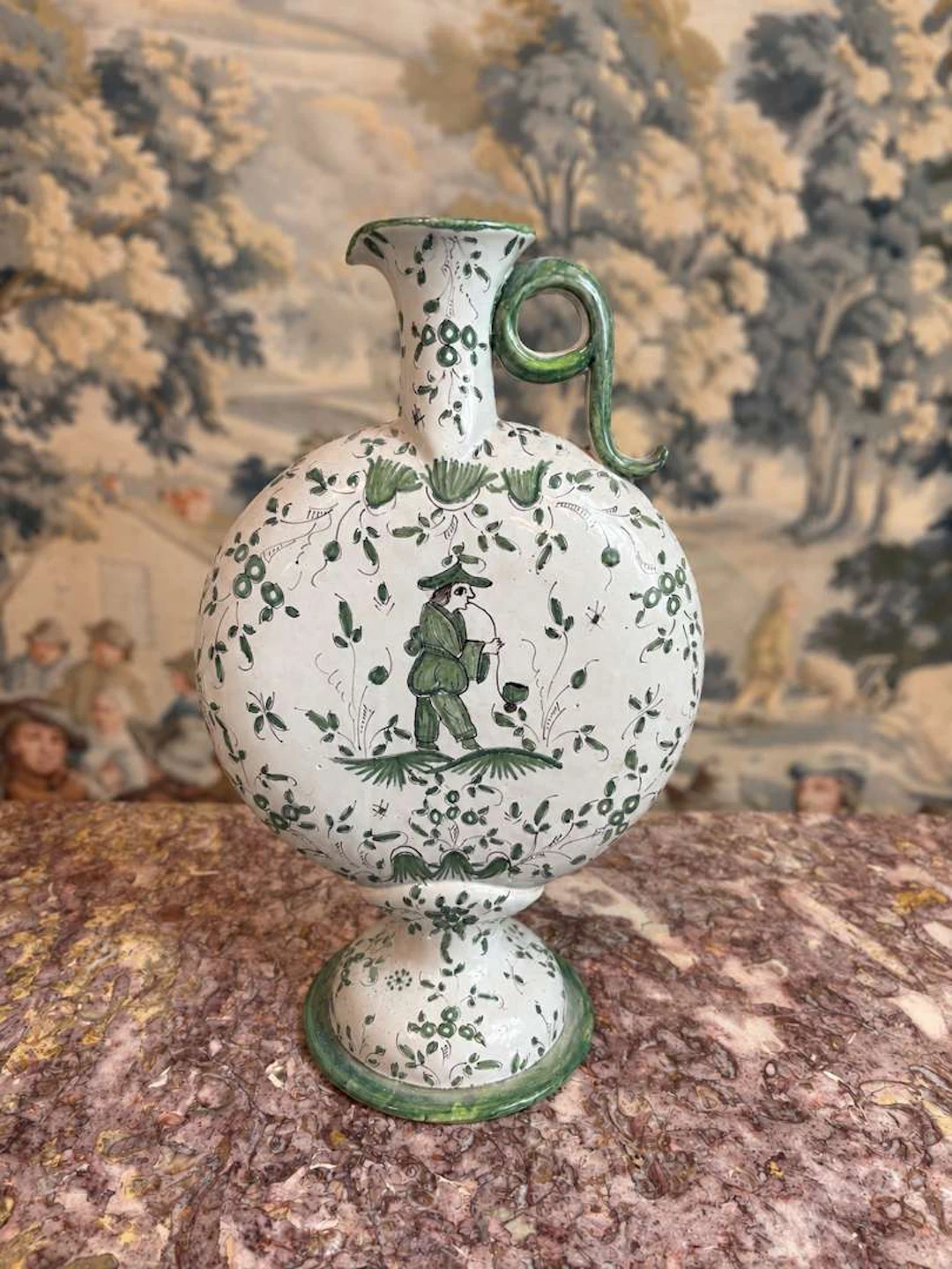 Water jug, made of earthenware with green decoration on a white background