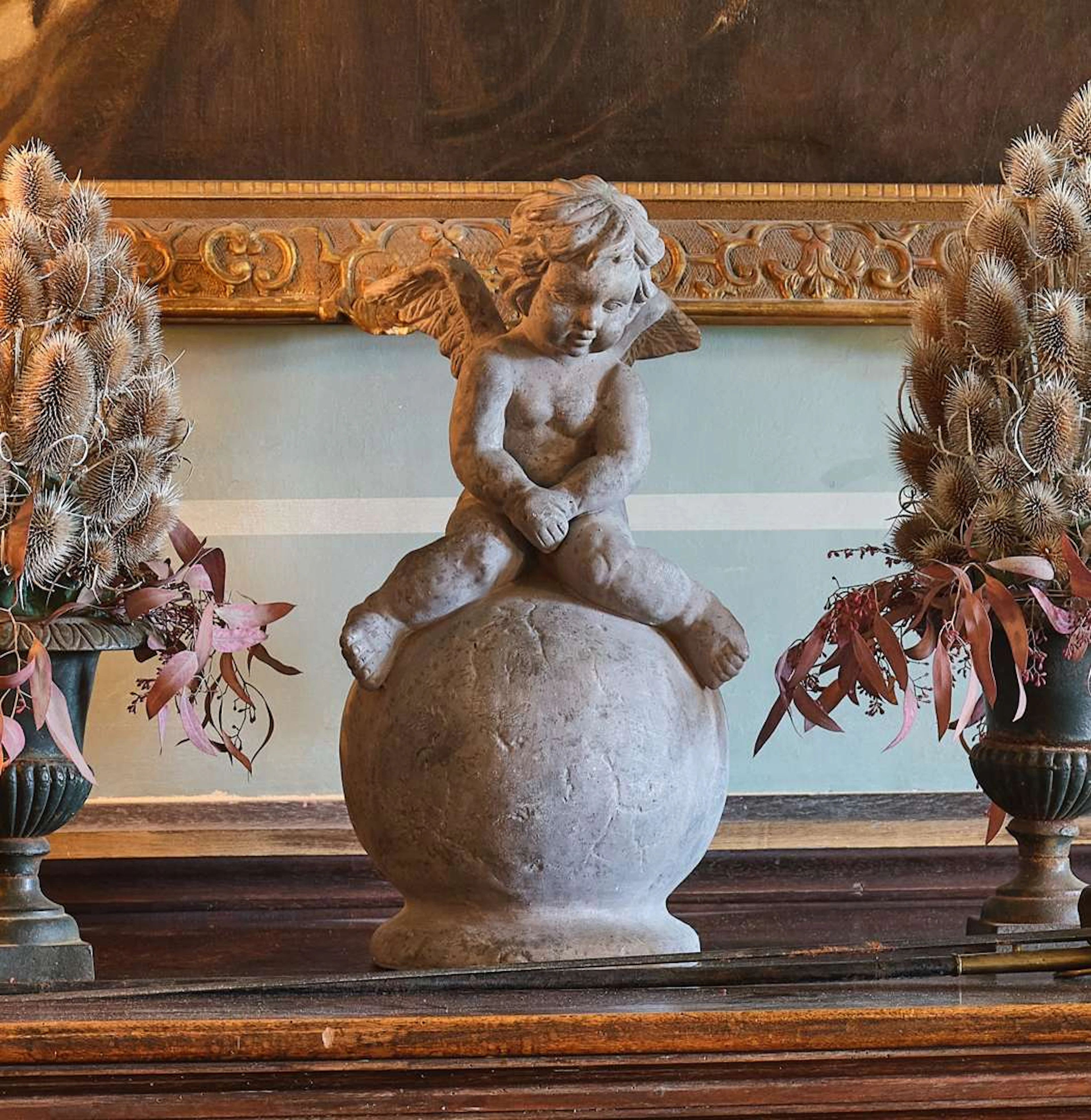 Putto on a globe, made of plaster