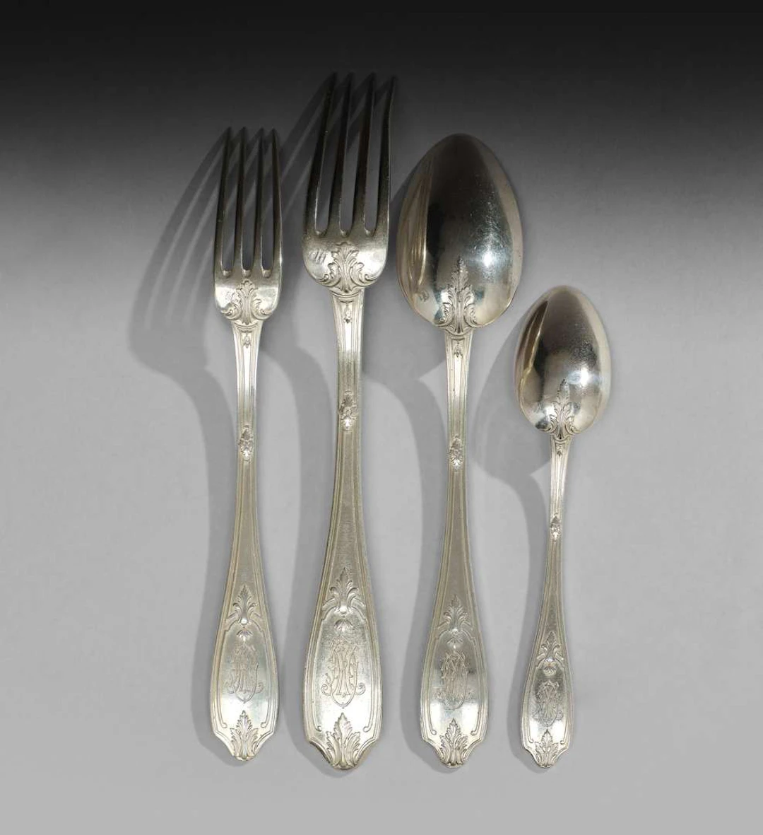 PUIFORCAT, A set of silver kitchen utensils featuring a lattice and