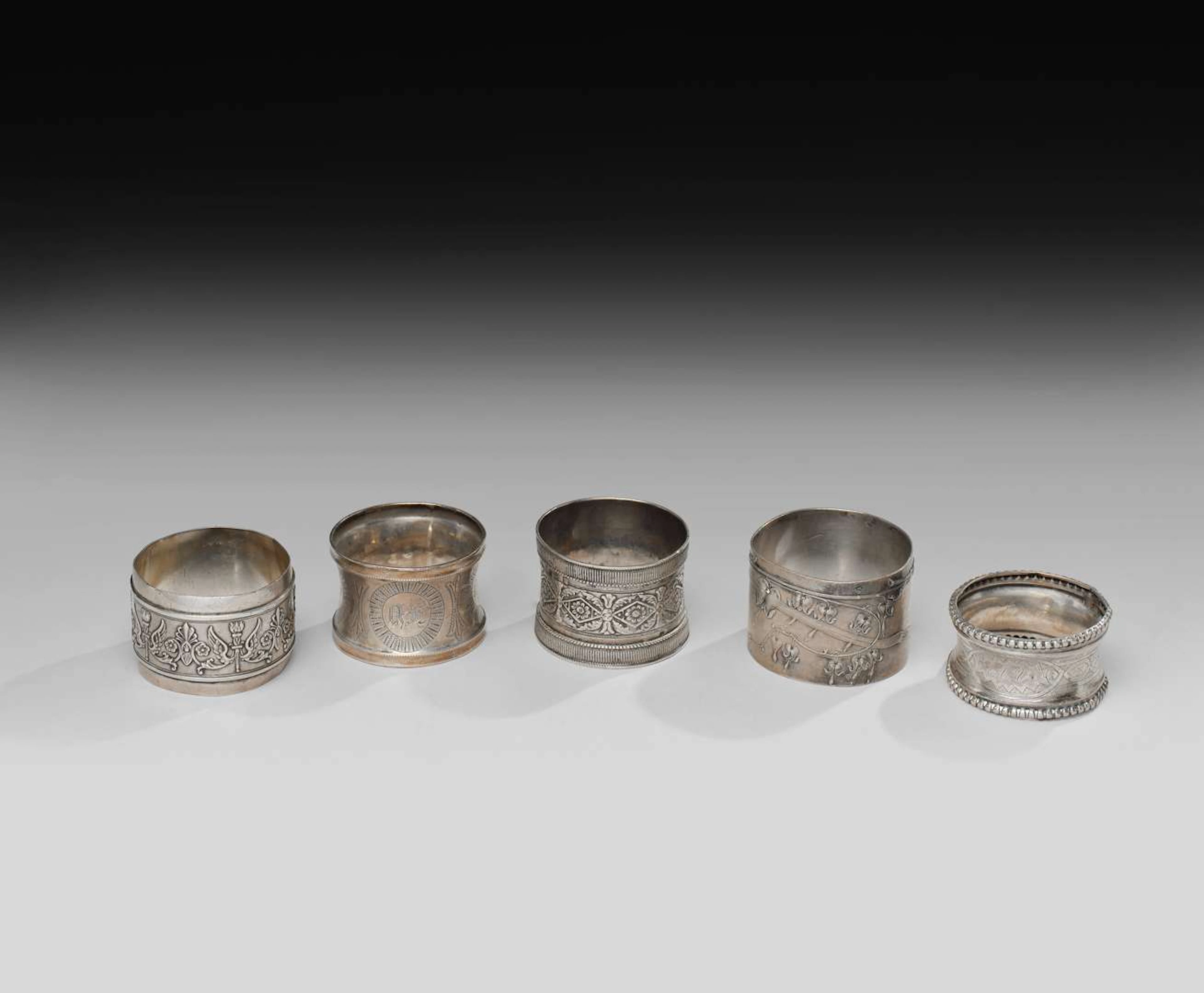 FIVE NAPKIN RINGS