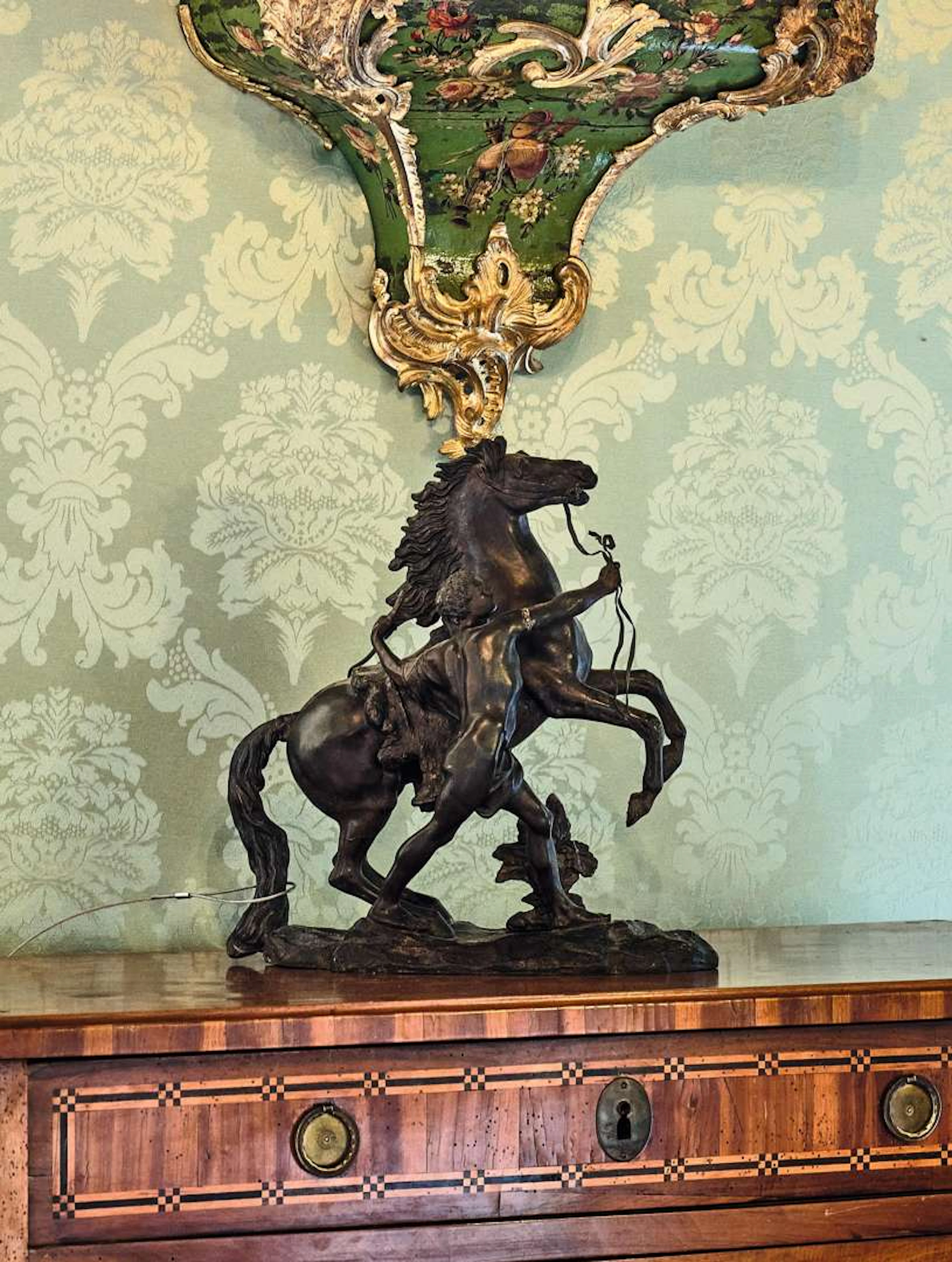 According to Guillaume COUSTOU, A horse held by a groom, based on