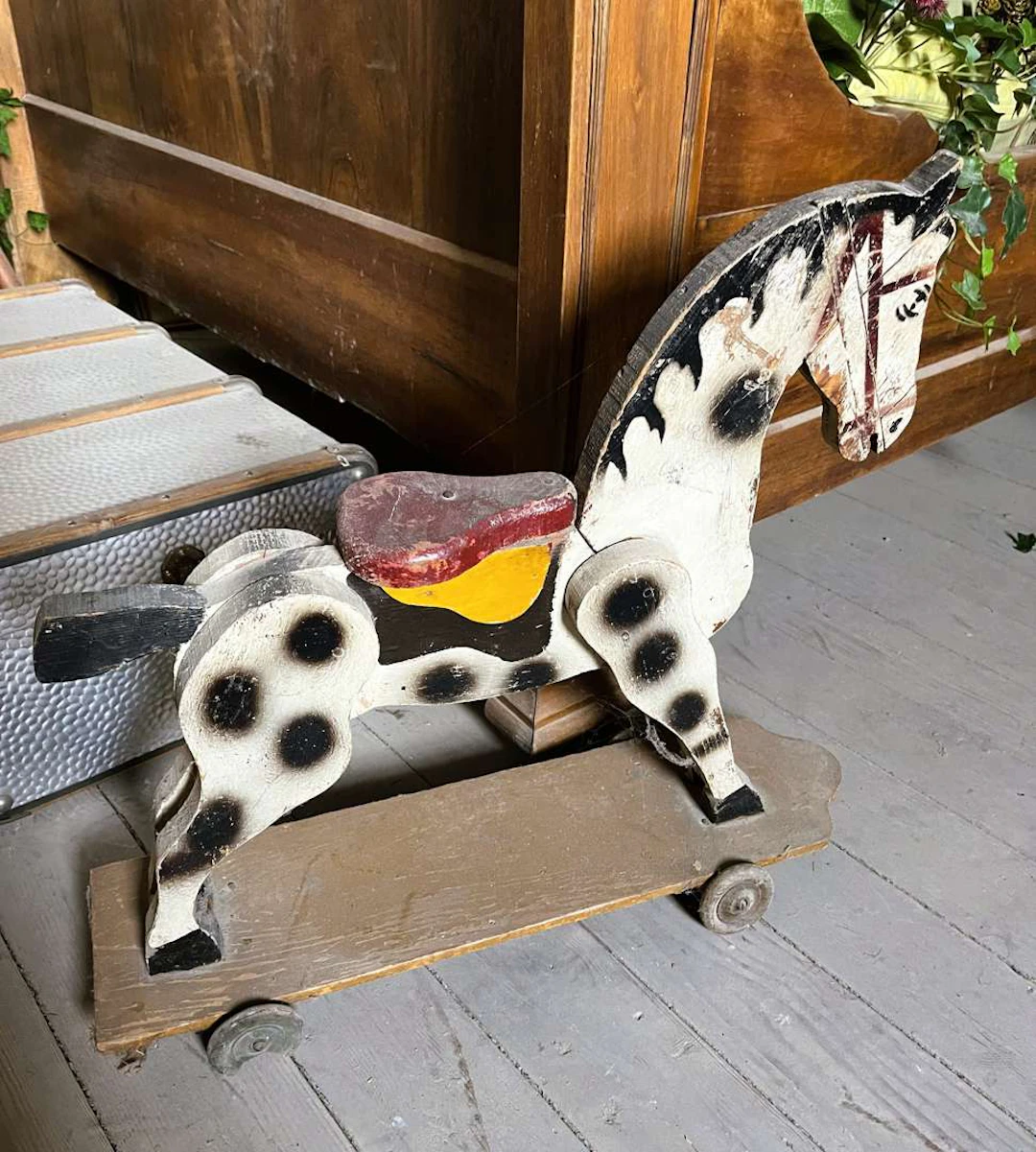 Rocking horse, made of painted wood on castors
