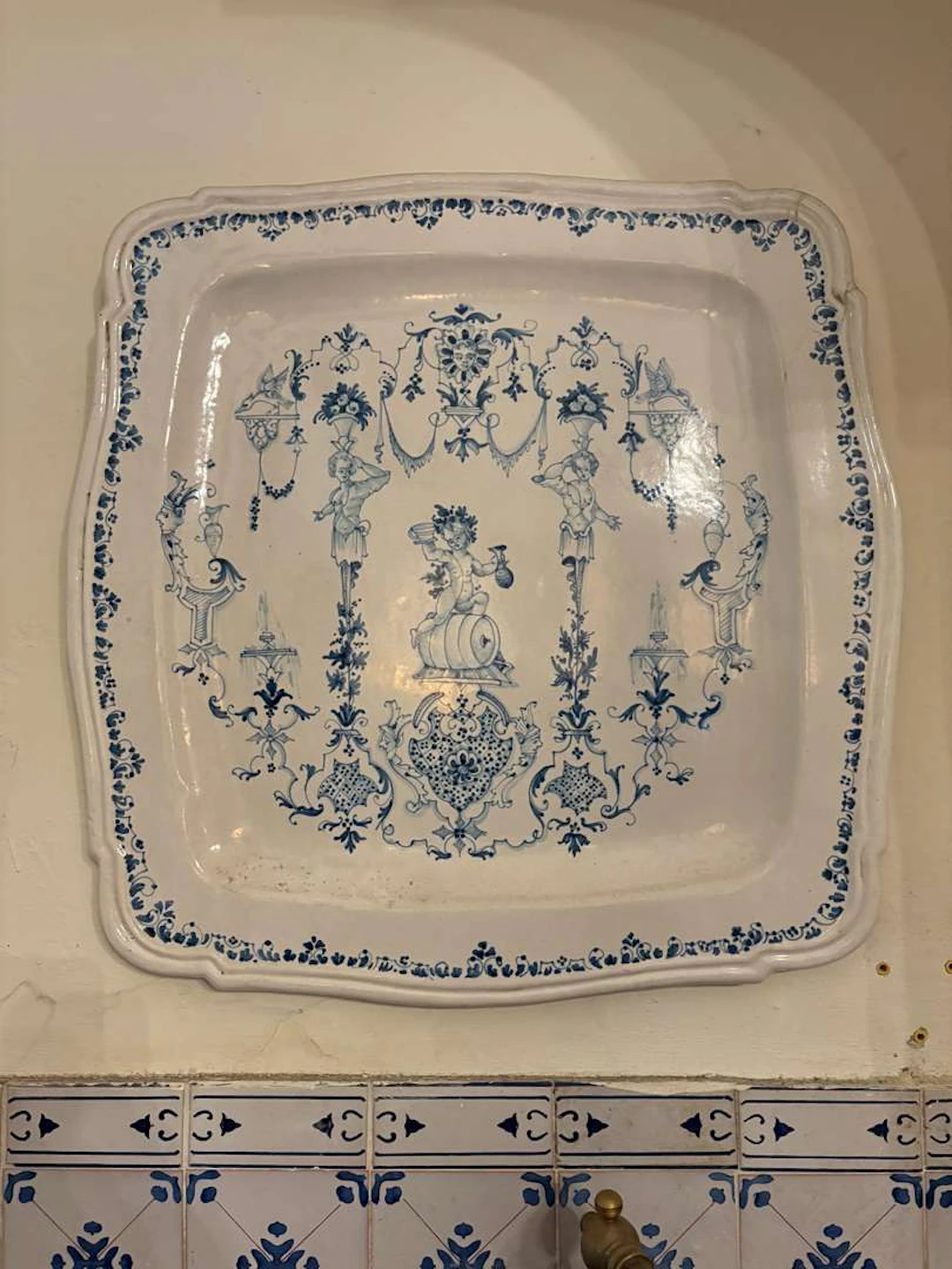 In the style of MOUSTIERS, Large square earthenware dish ‘à la Bérain’
