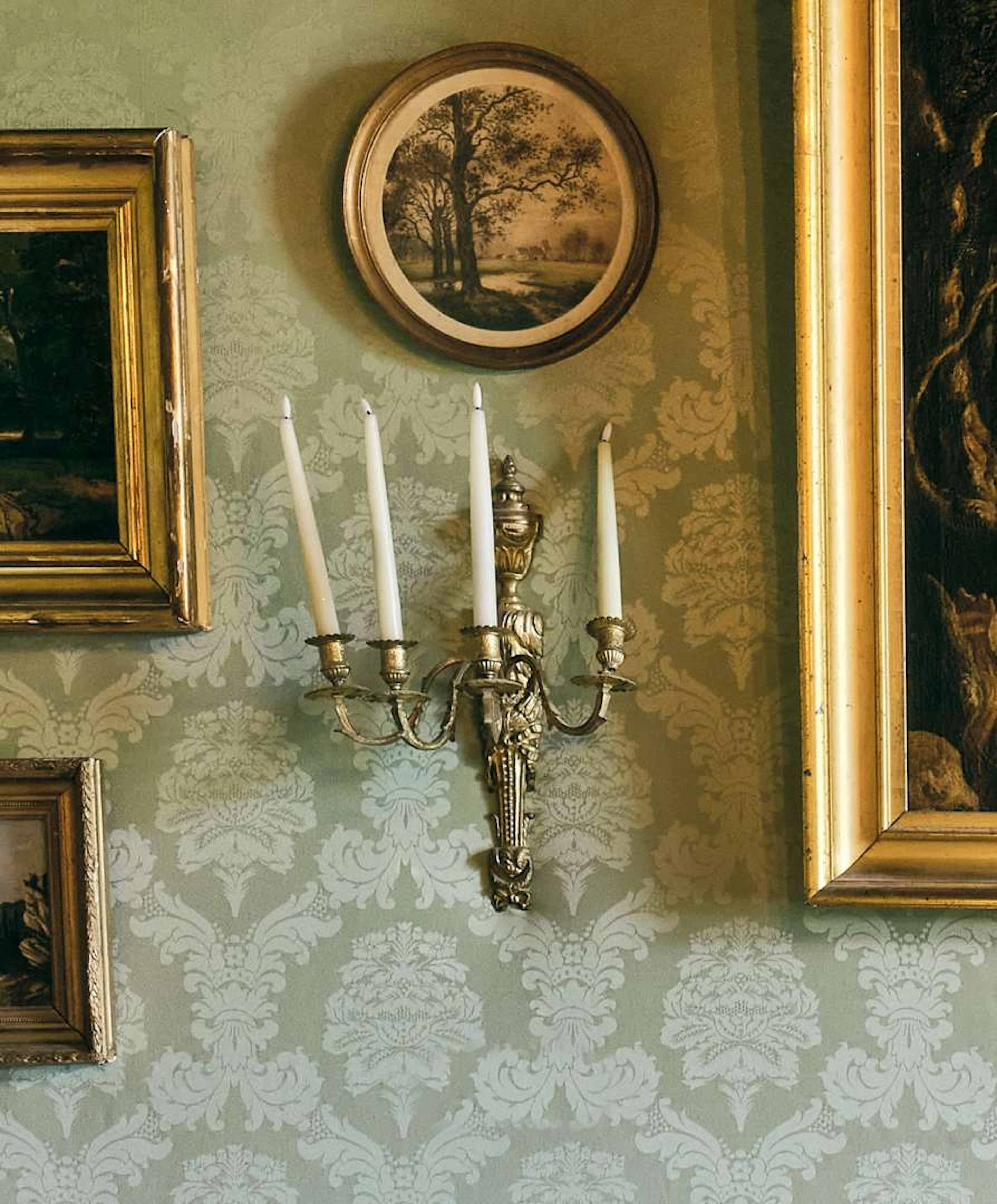 Pair of wall lights, in gilded bronze with four light arms