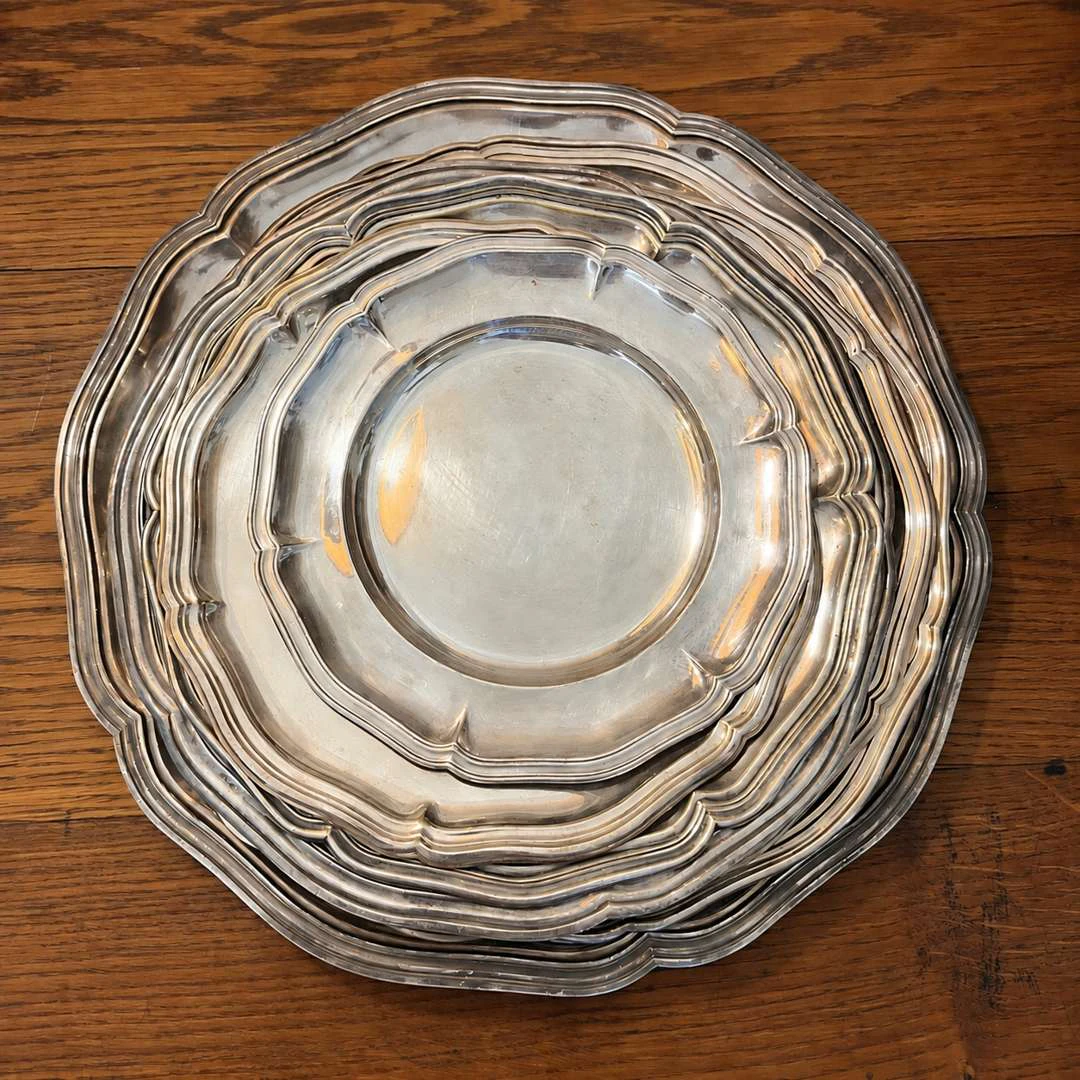 [MAIN COURSES], Set of nine round metal and silver-plated plates