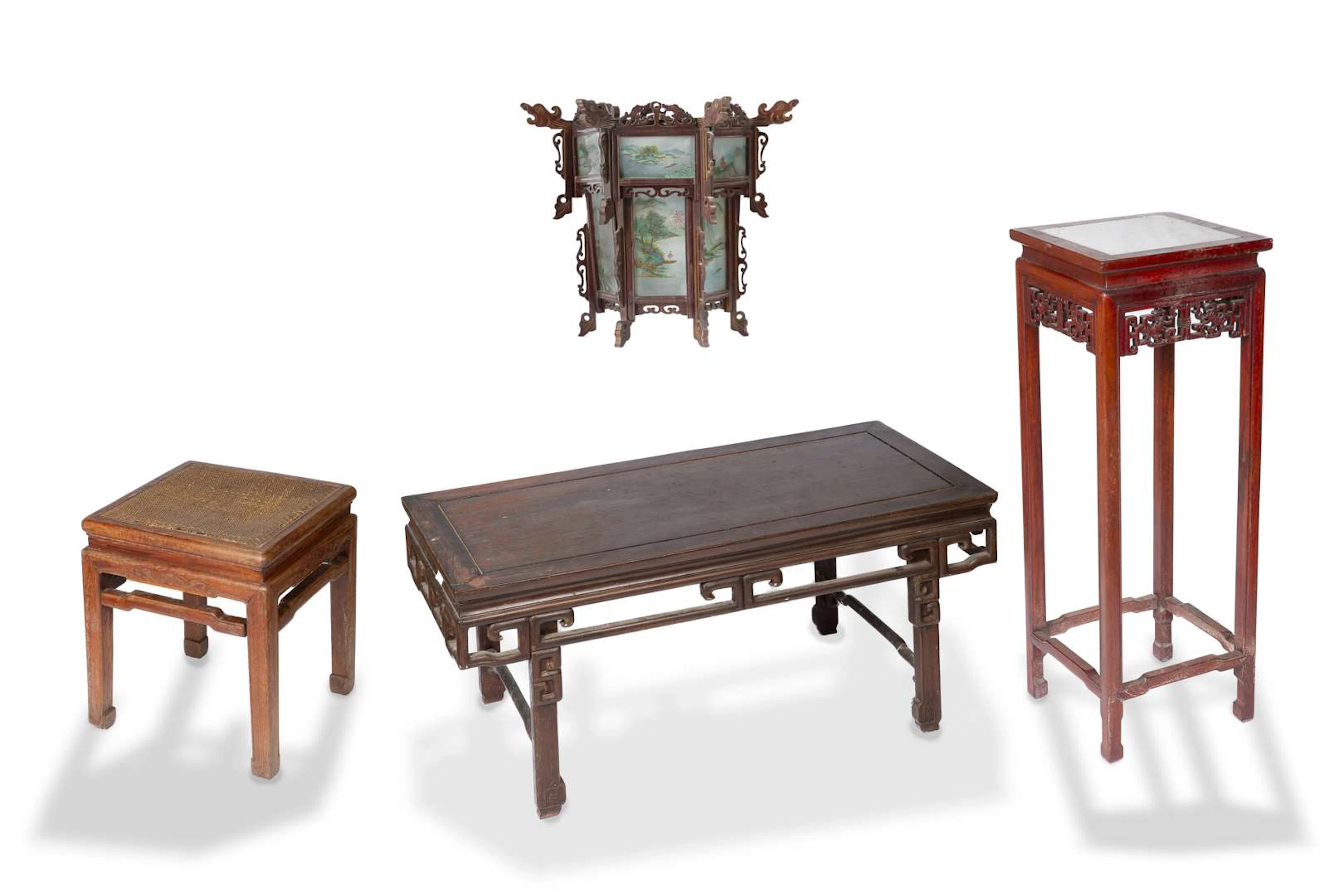 A set of furniture comprising a small armchair, a coffee table, a