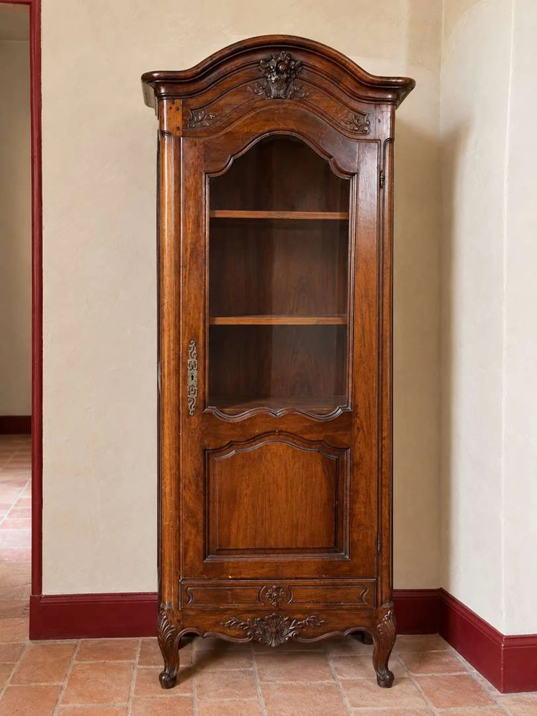Showcase, carved and moulded wood