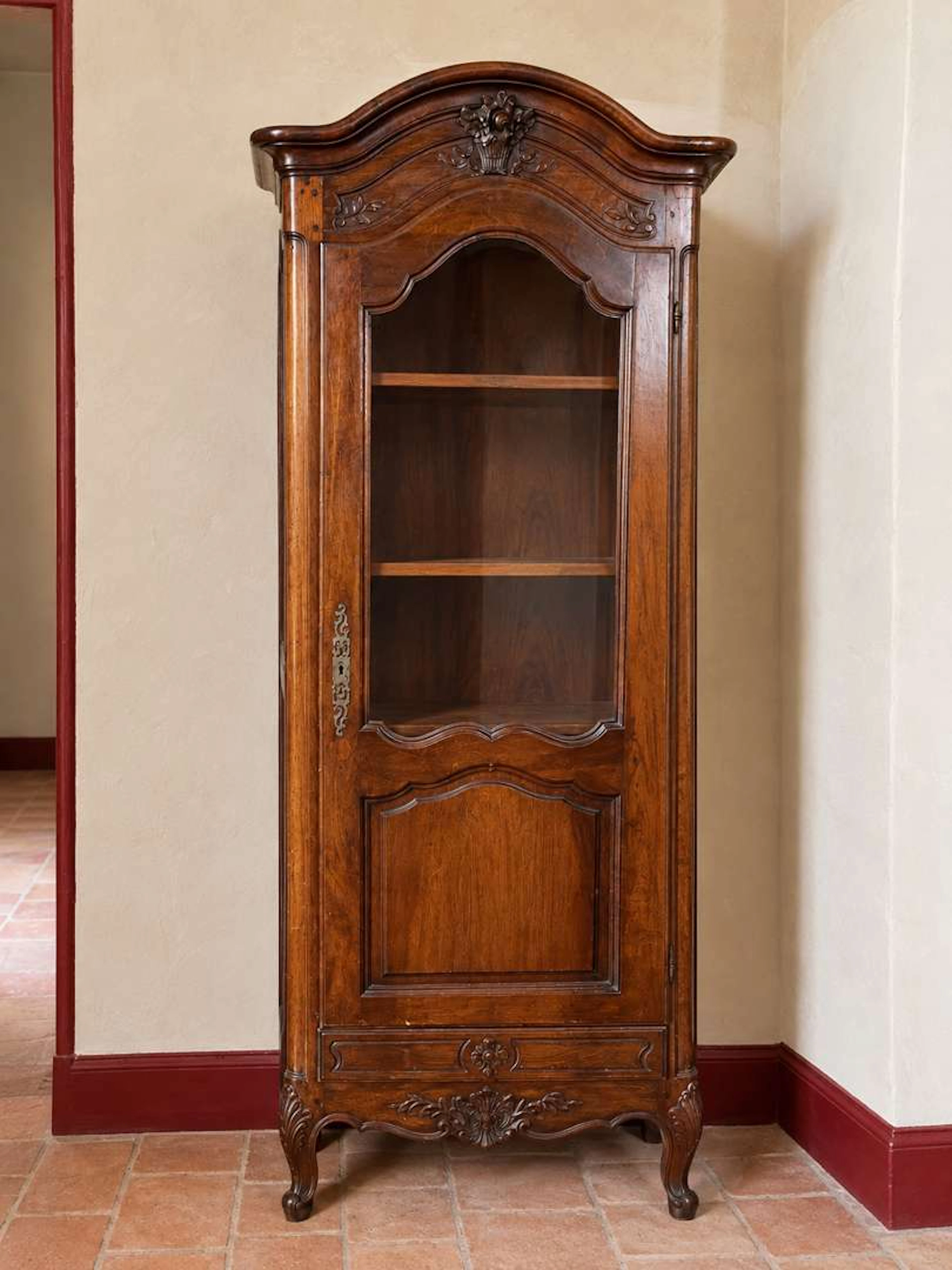 Showcase, carved and moulded wood
