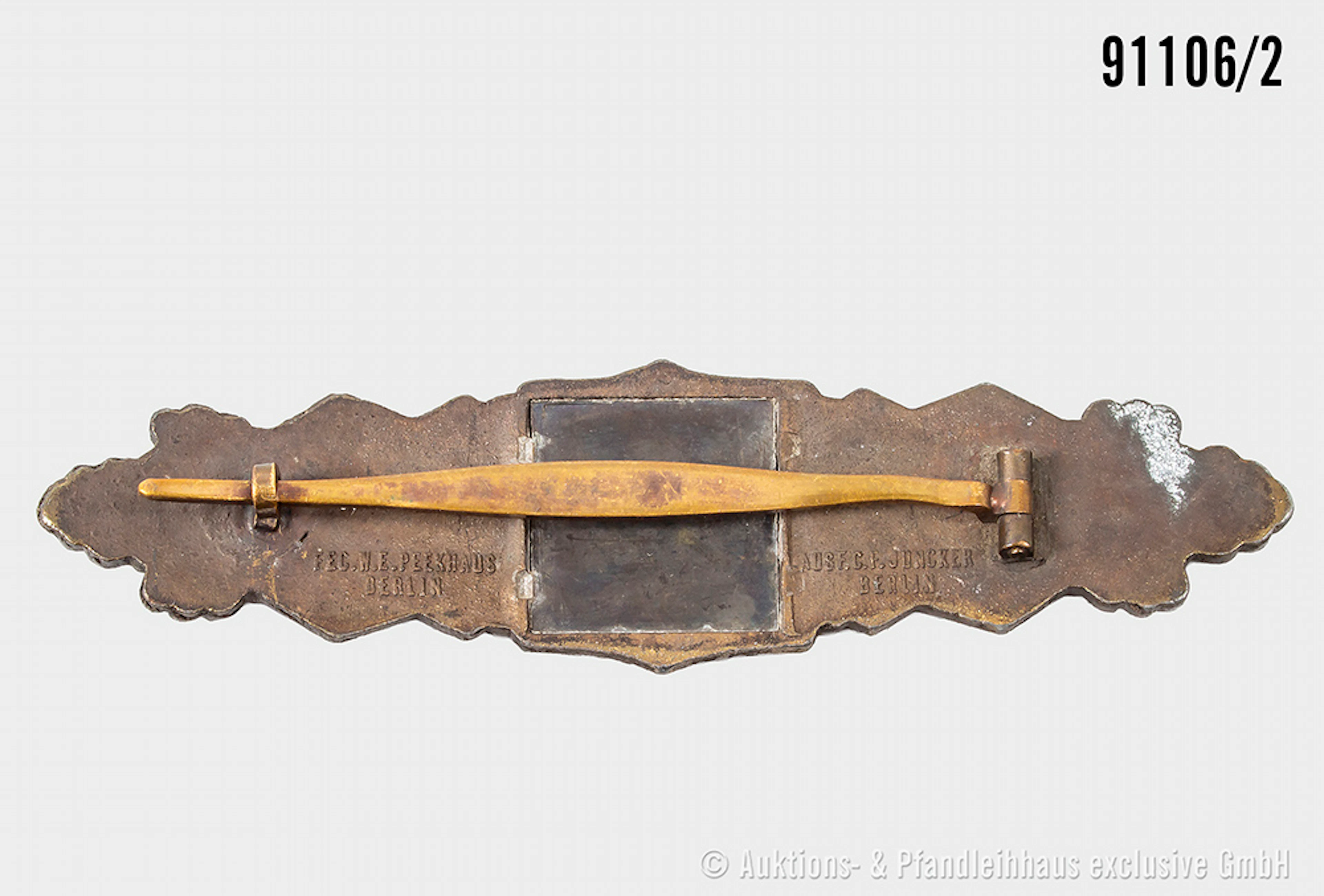 Nahkampfspange in Bronze, Zinkausführung, Herstelle "Juncker", dazugehöiges