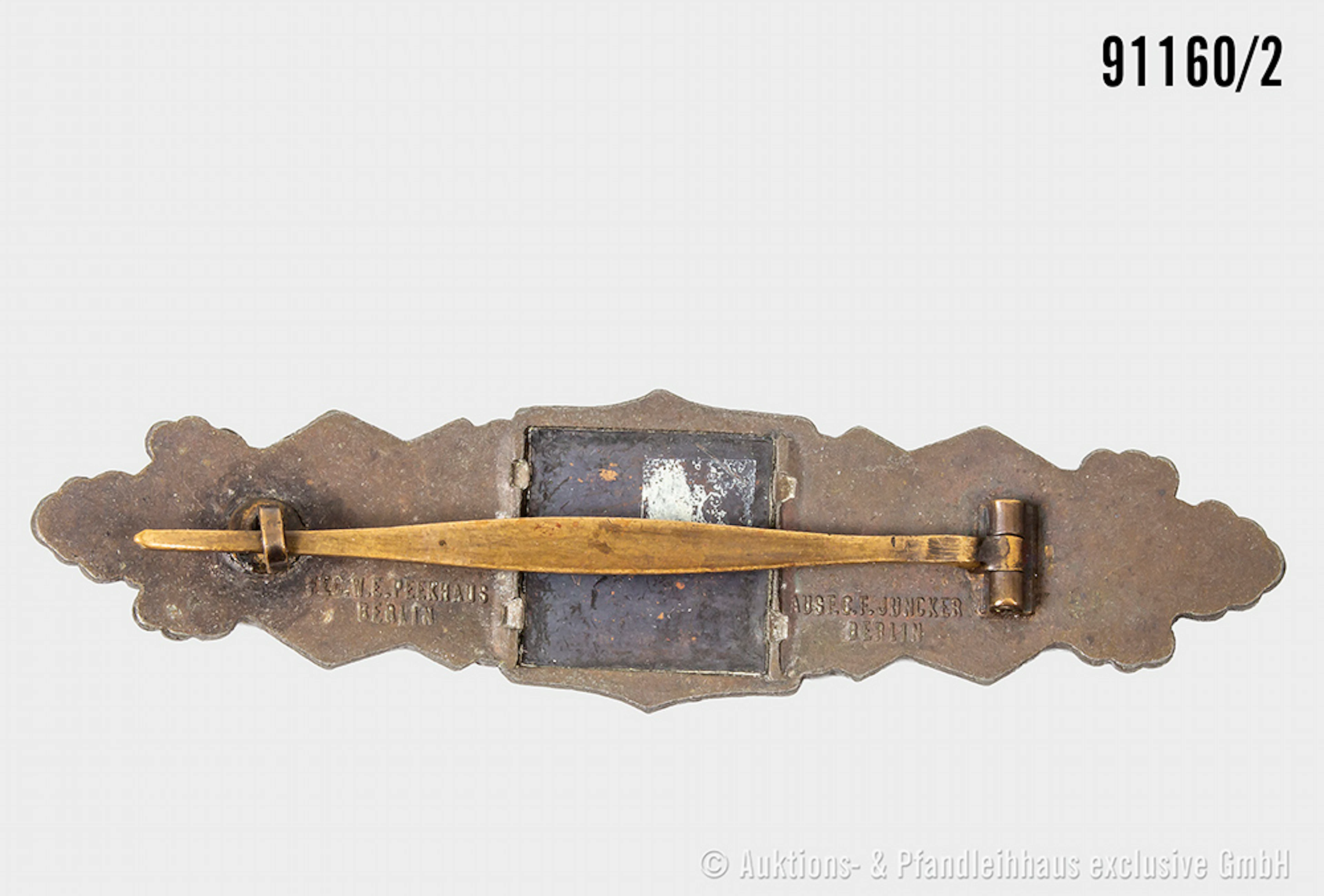 Nahkampfspange in Bronze, Zinkausf., Hersteller "Juncker Berlin"