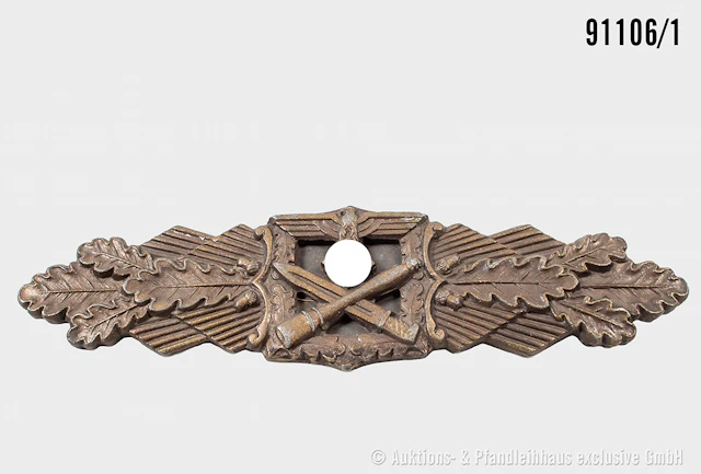 Nahkampfspange in Bronze, Zinkausführung, Herstelle "Juncker", dazugehöiges