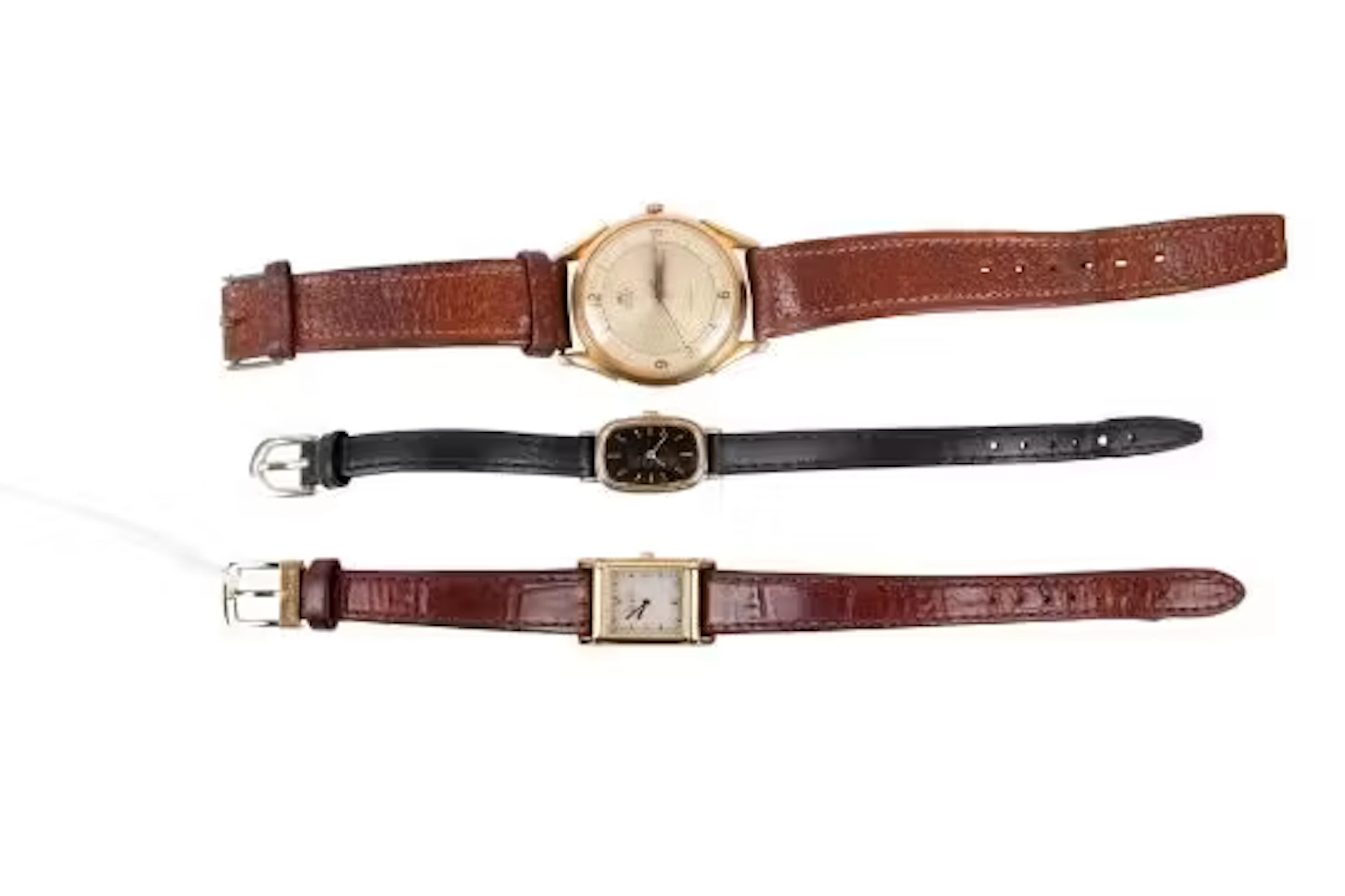 Three wristwatches.