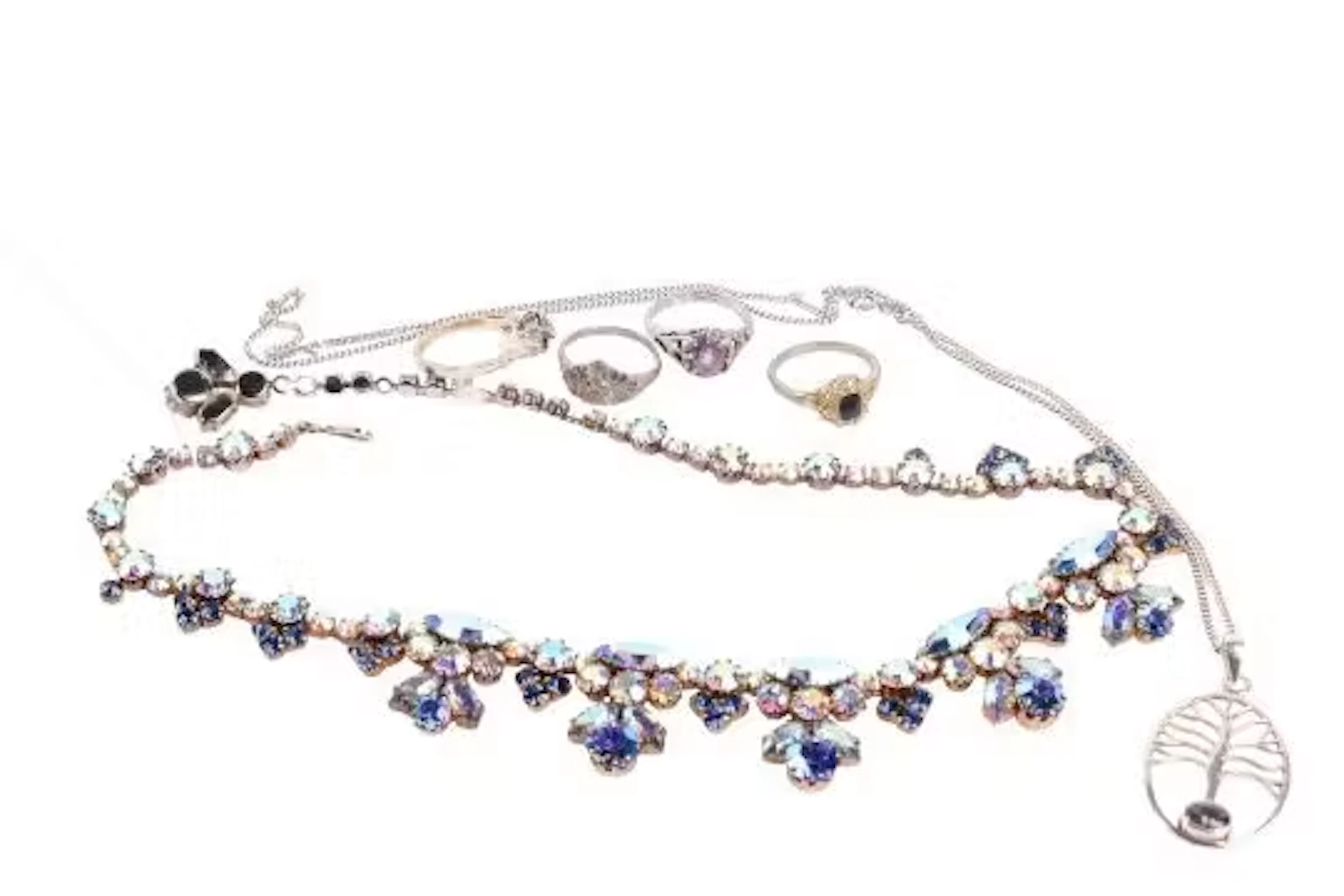 A collection of costume jewellery. Comprising a silver pendant and