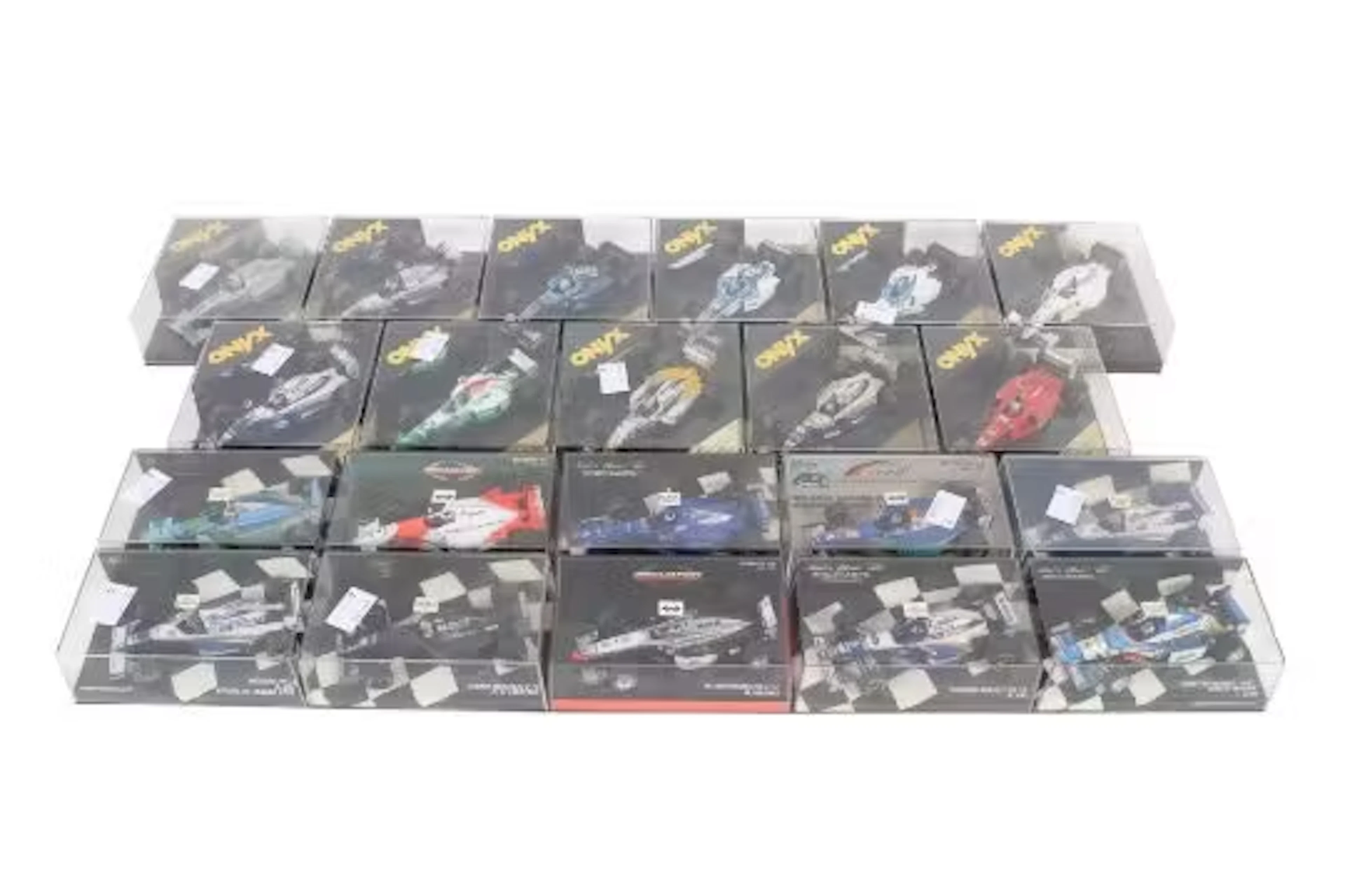 Twenty-one boxed diecast model racing cars. Comprising ten Onyx examples