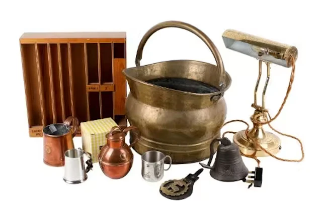 A collection of assorted metalware and a scratch built wooden stand.
