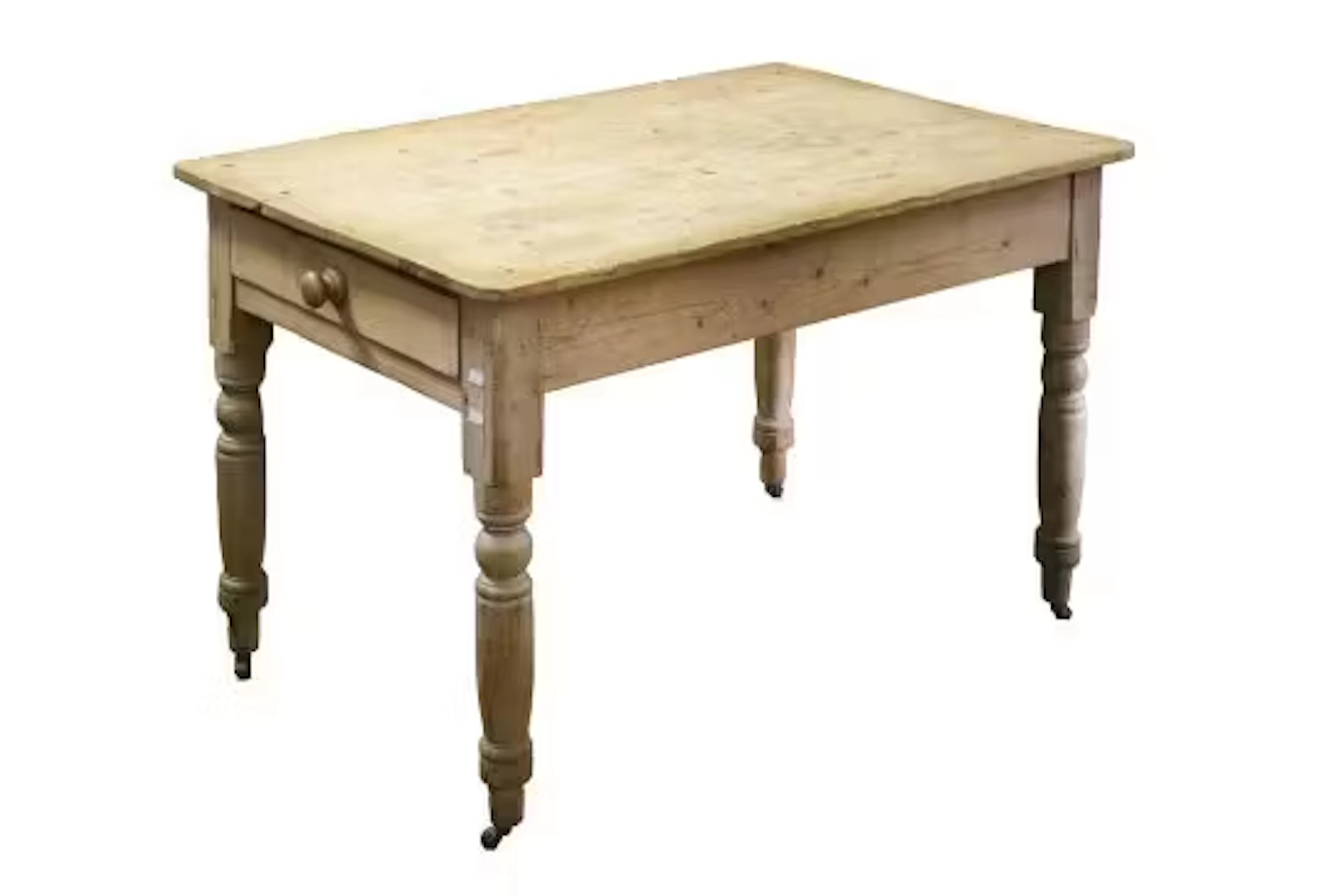 A vintage scrubbed pine kitchen table.