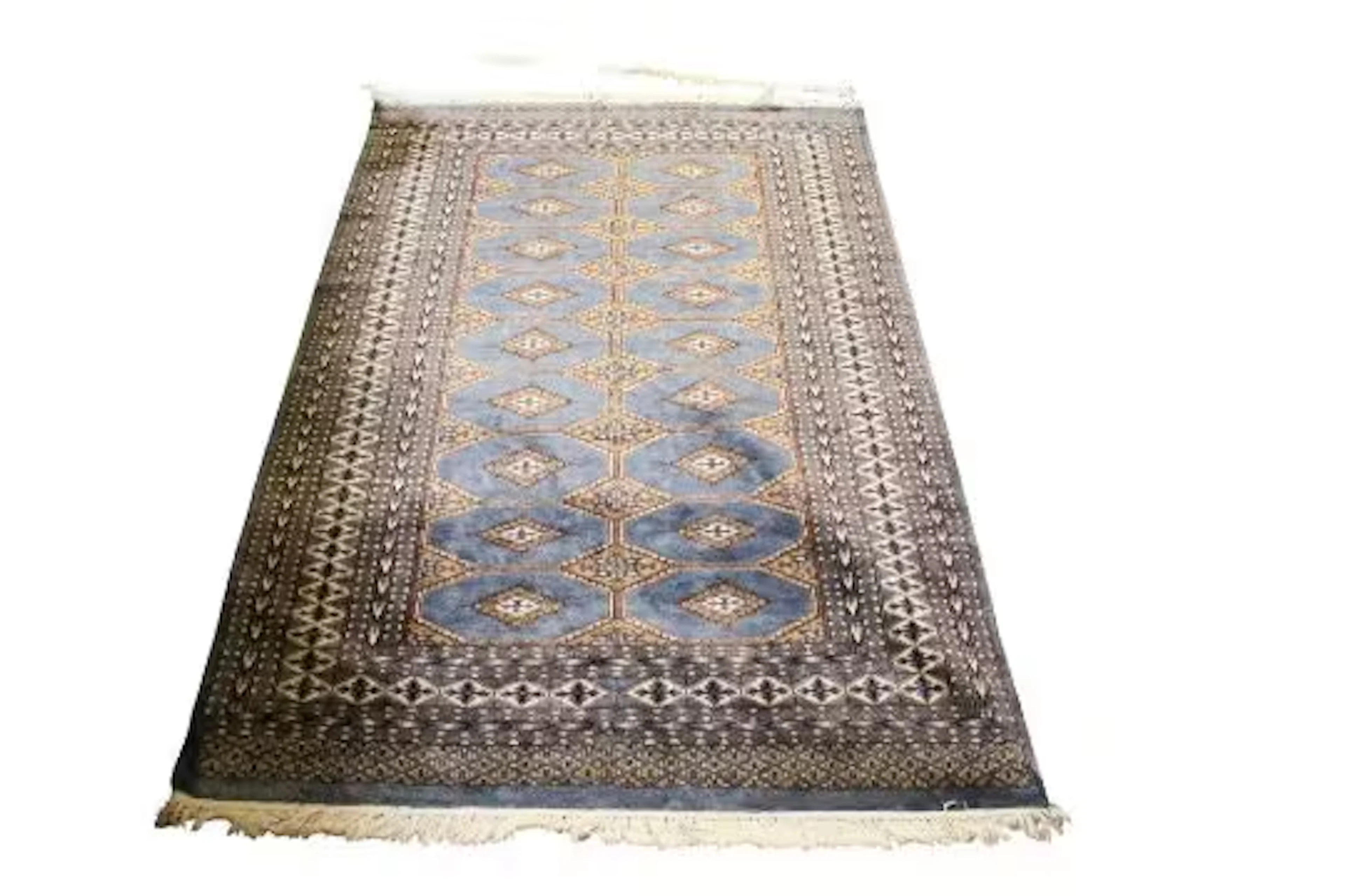 A contemporary Indian Bokhara style wool rug on a blue ground.