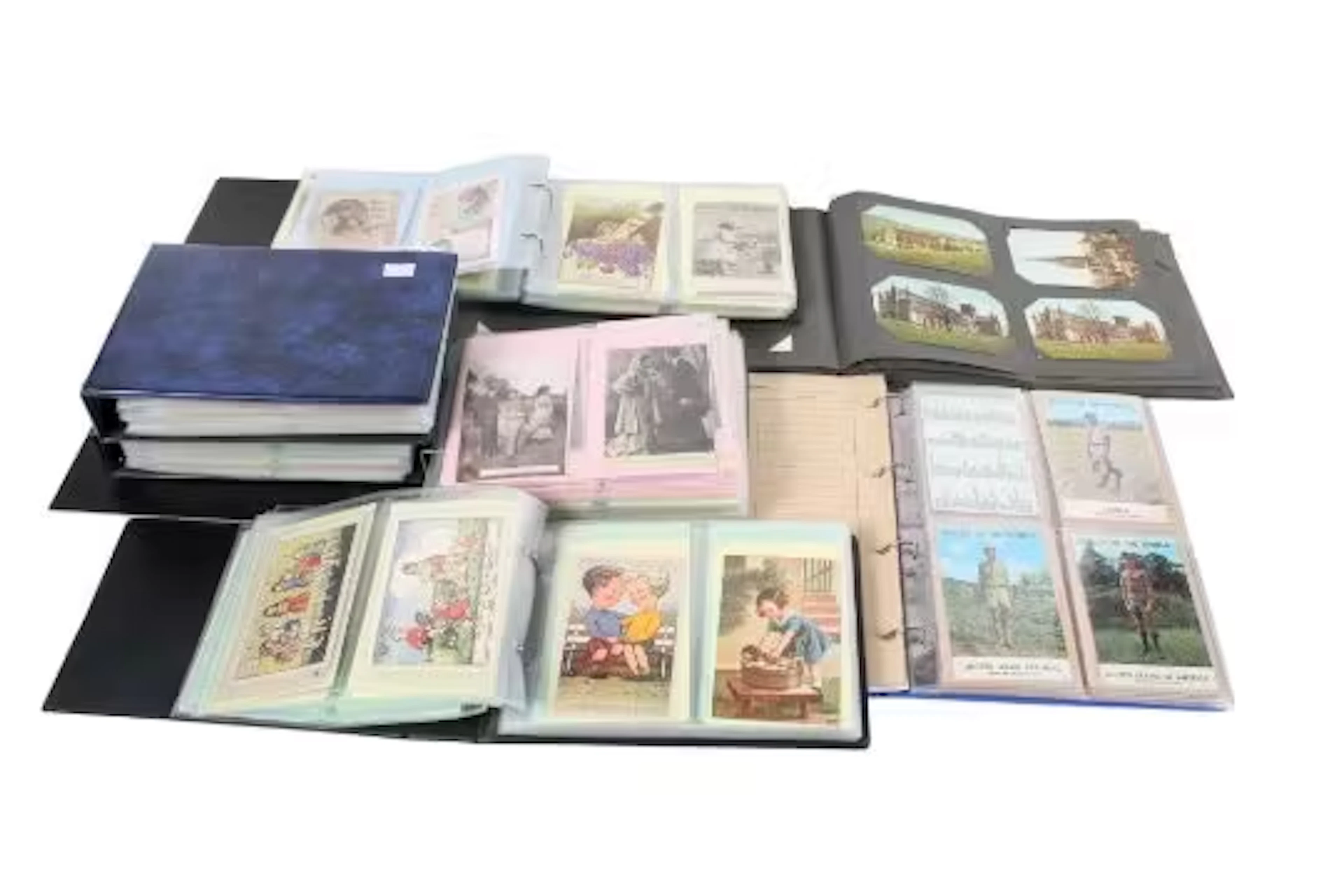 Eight albums of vintage and modern postcards.