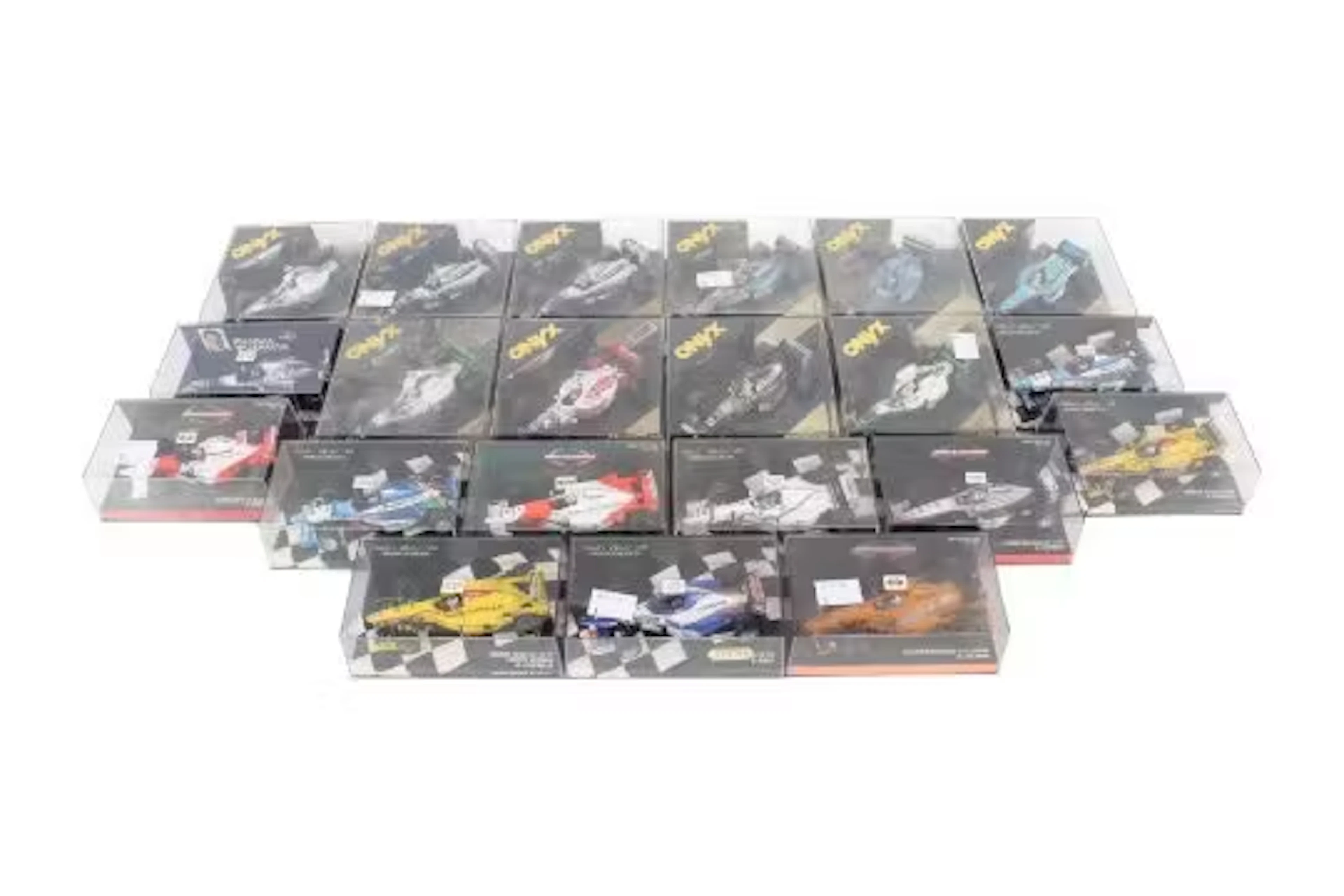 Twenty-one boxed diecast model racing cars. Comprising ten Onyx examples