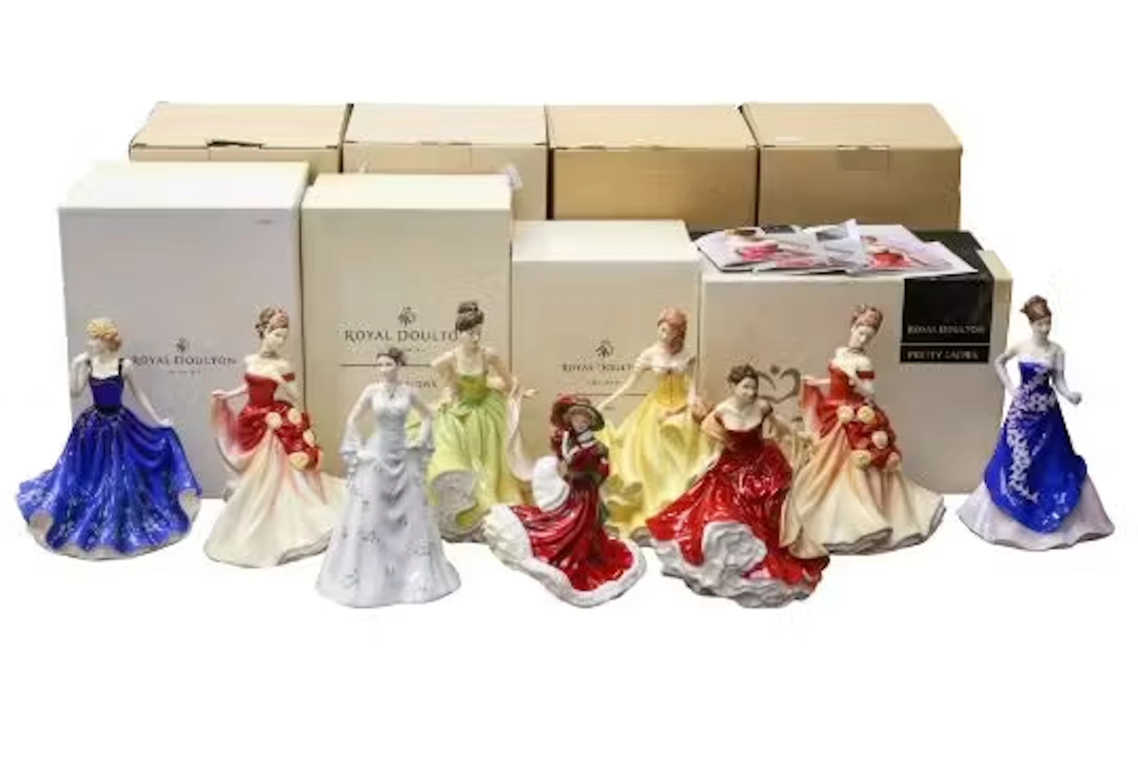 A collection of nine assorted Royal Doulton porcelain 'Lady' figurines.