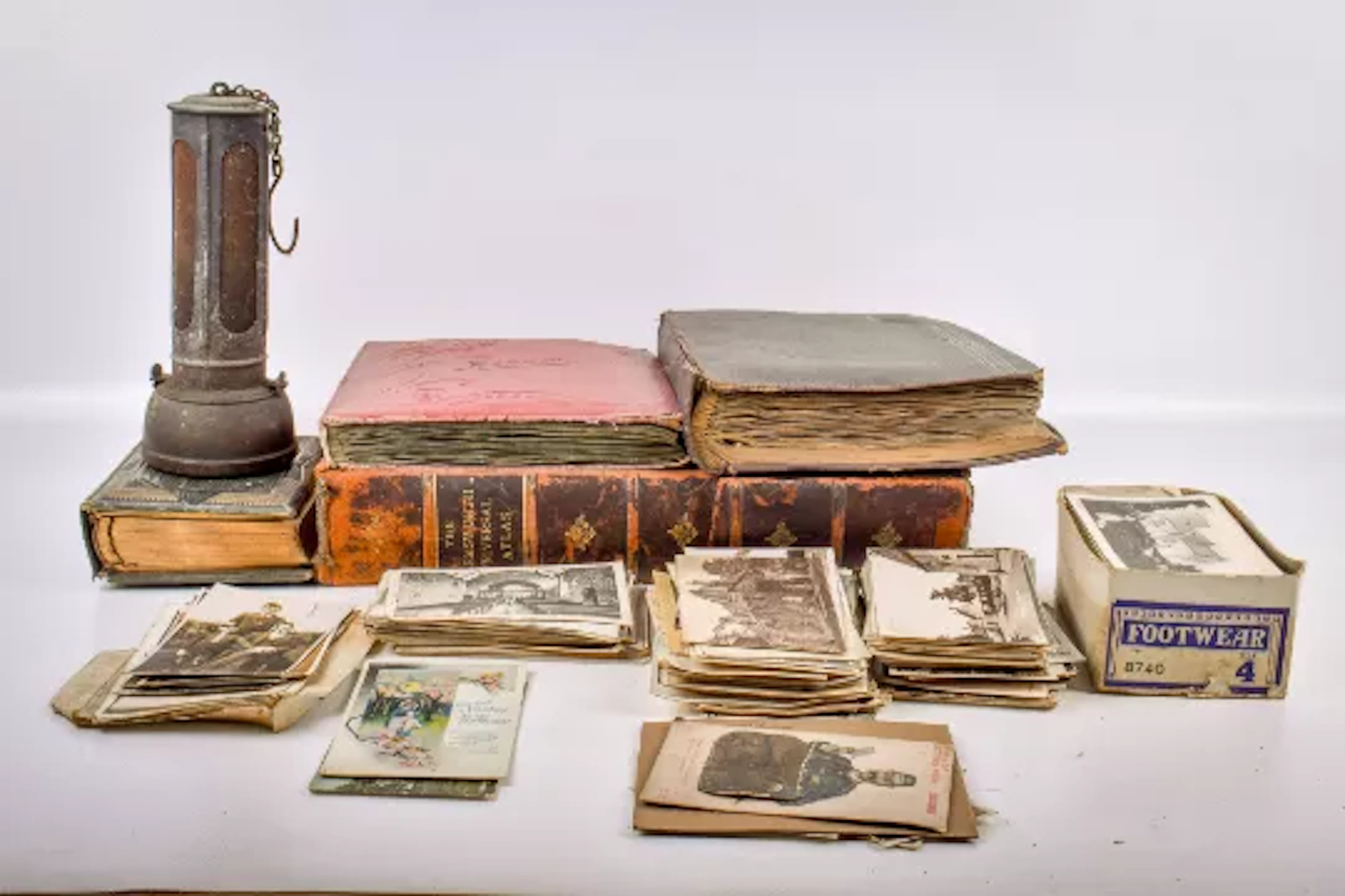 A collection of assorted postcards, photographs and collectables.
