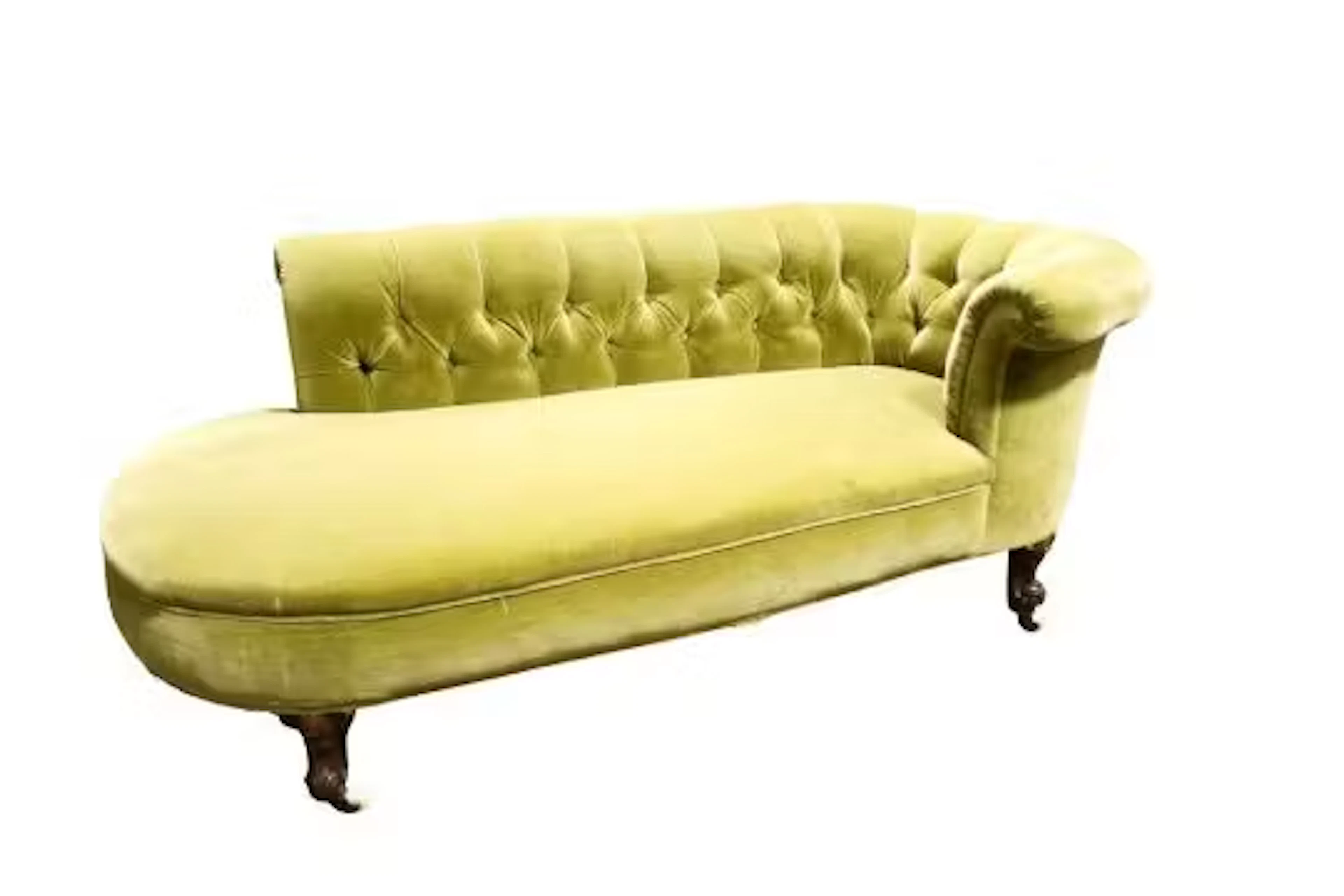 An olive green velvet upholstered chaise longue. Having carved supports