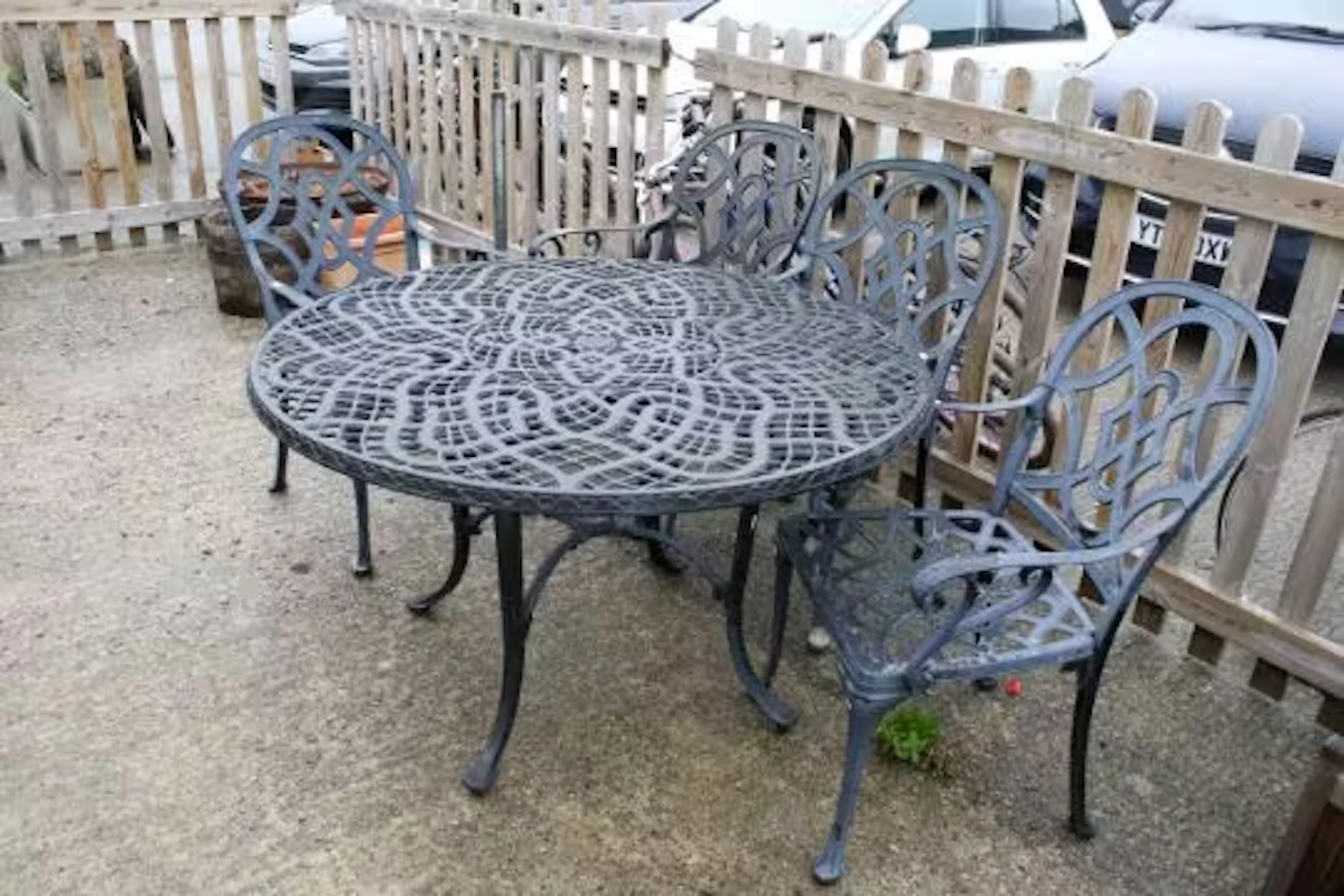 An aluminium Nova Garden Furniture four-seat bistro set. With similar