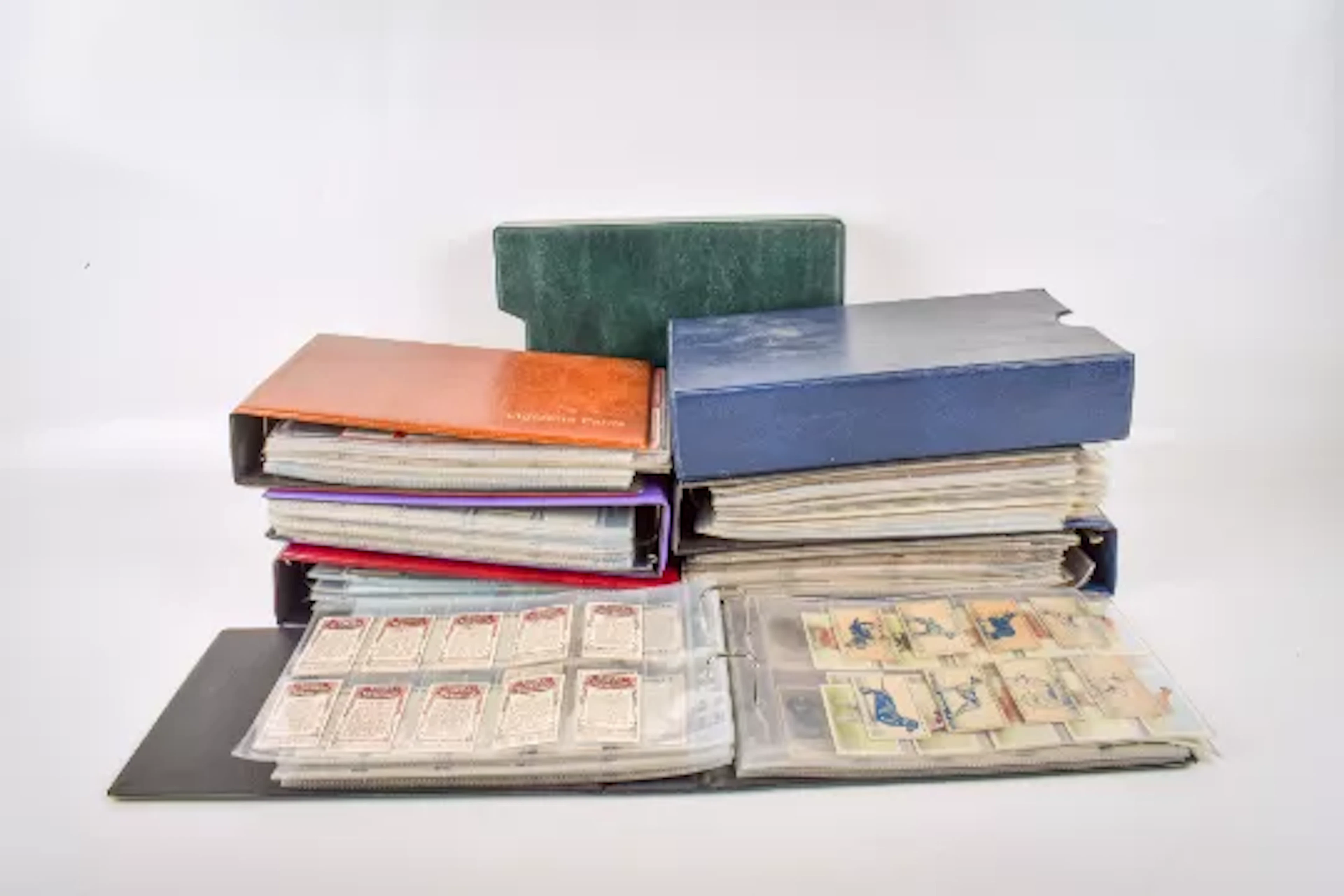 A large collection of assorted cigarette trading cards, in seven ring binders.