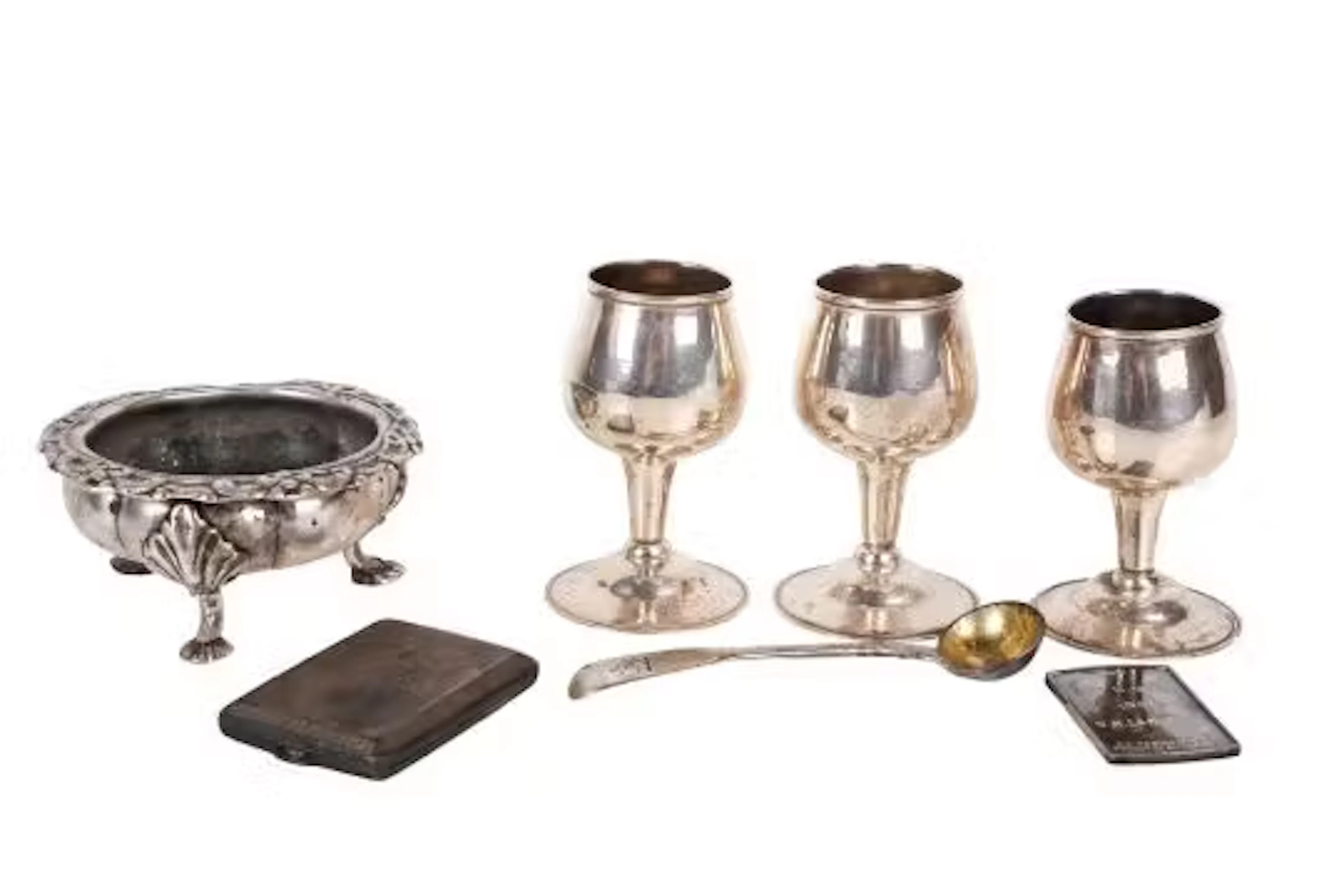 A small group of assorted silver pieces.