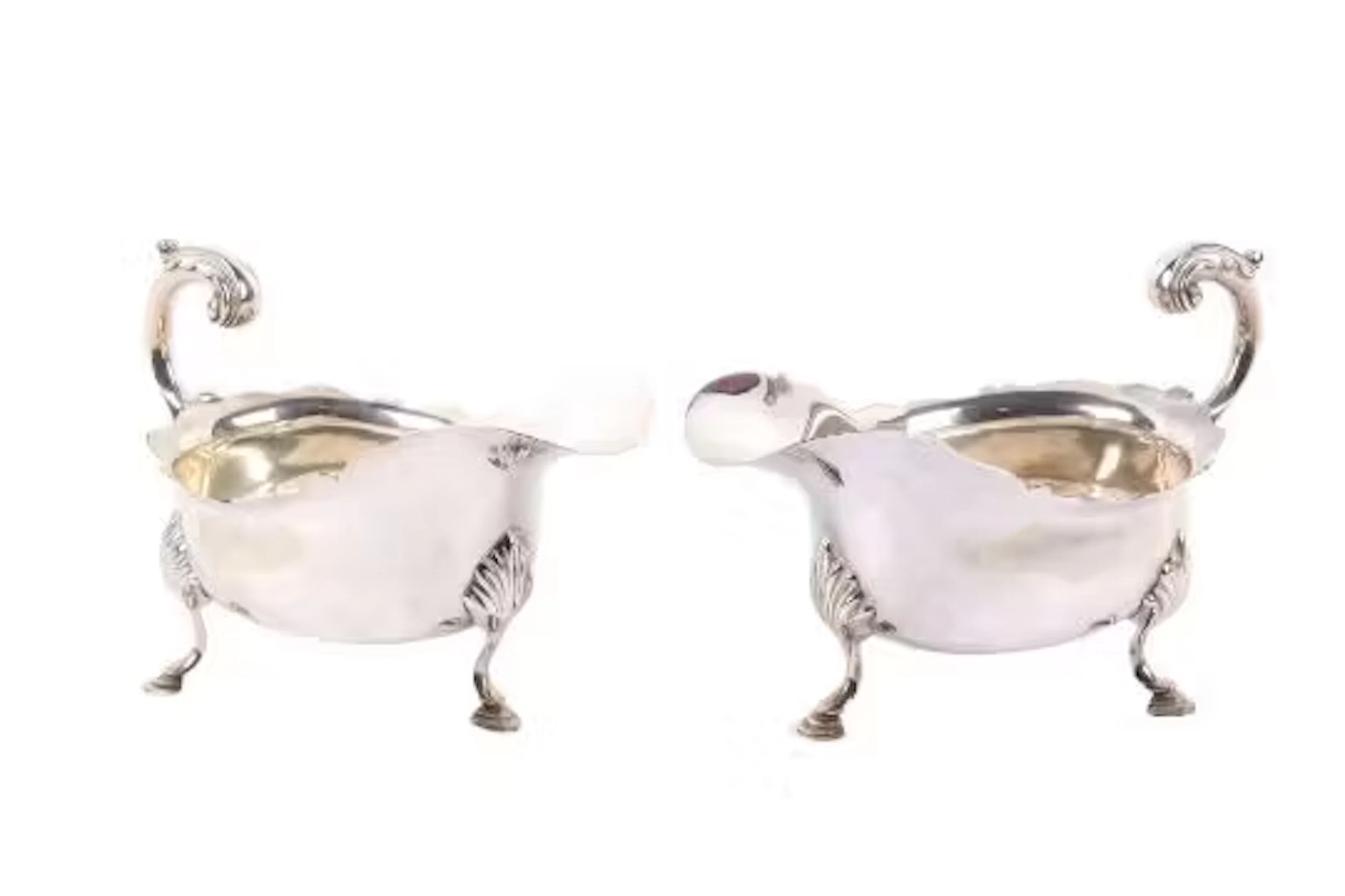 A pair of matched silver sauce boats.