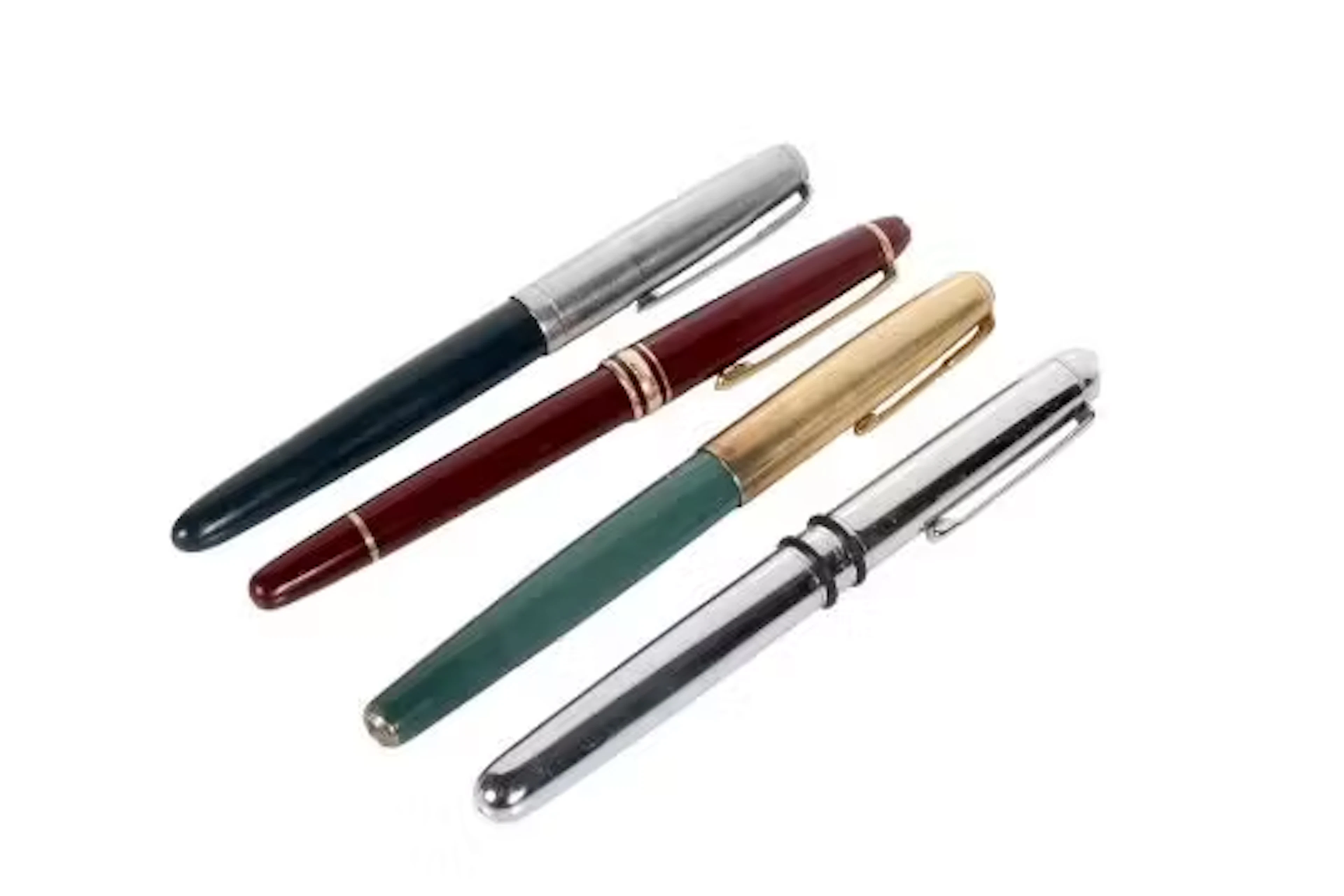 A group of four assorted fountain pens. Including a Montblanc Meisterstuck