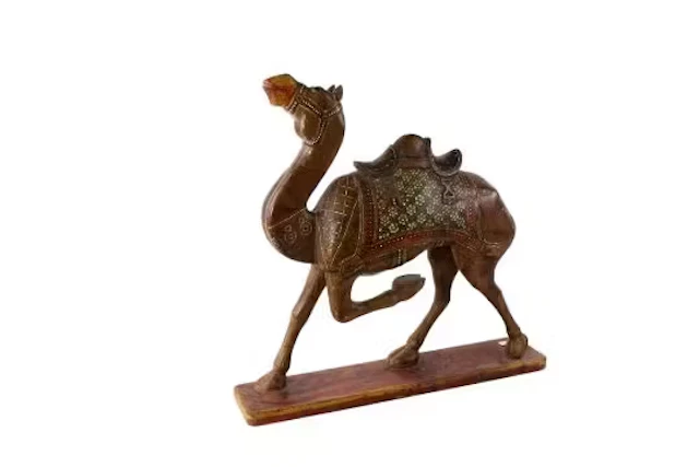 A vintage wooden camel sculpture from Rajistan.
