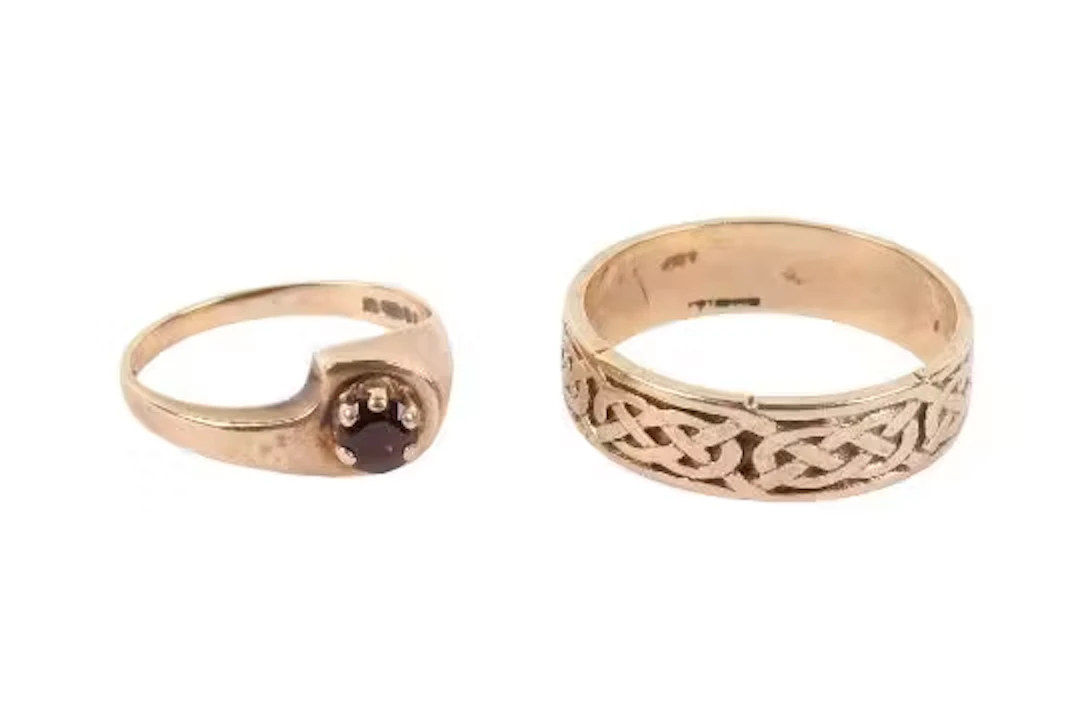 Two 9ct gold rings. Comprising a Celtic band with engraved decoration