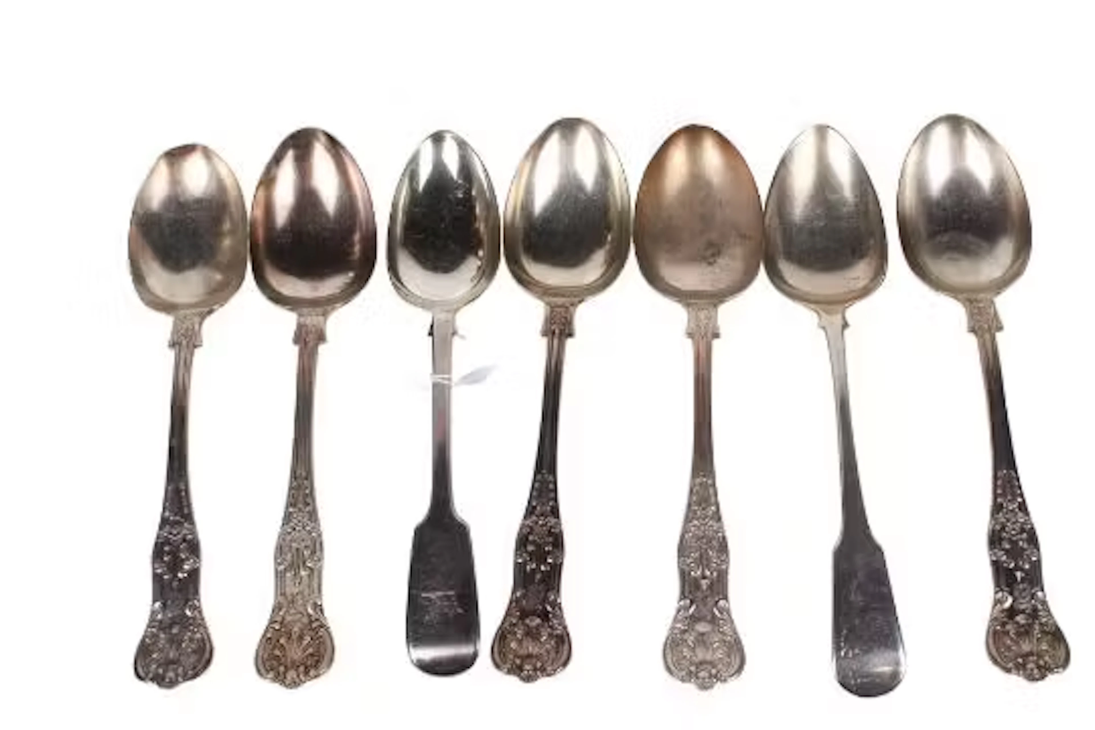 Seven Georgian and later silver serving spoons.