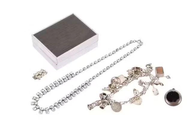 A small group of silver and costume jewellery and a watch fob.