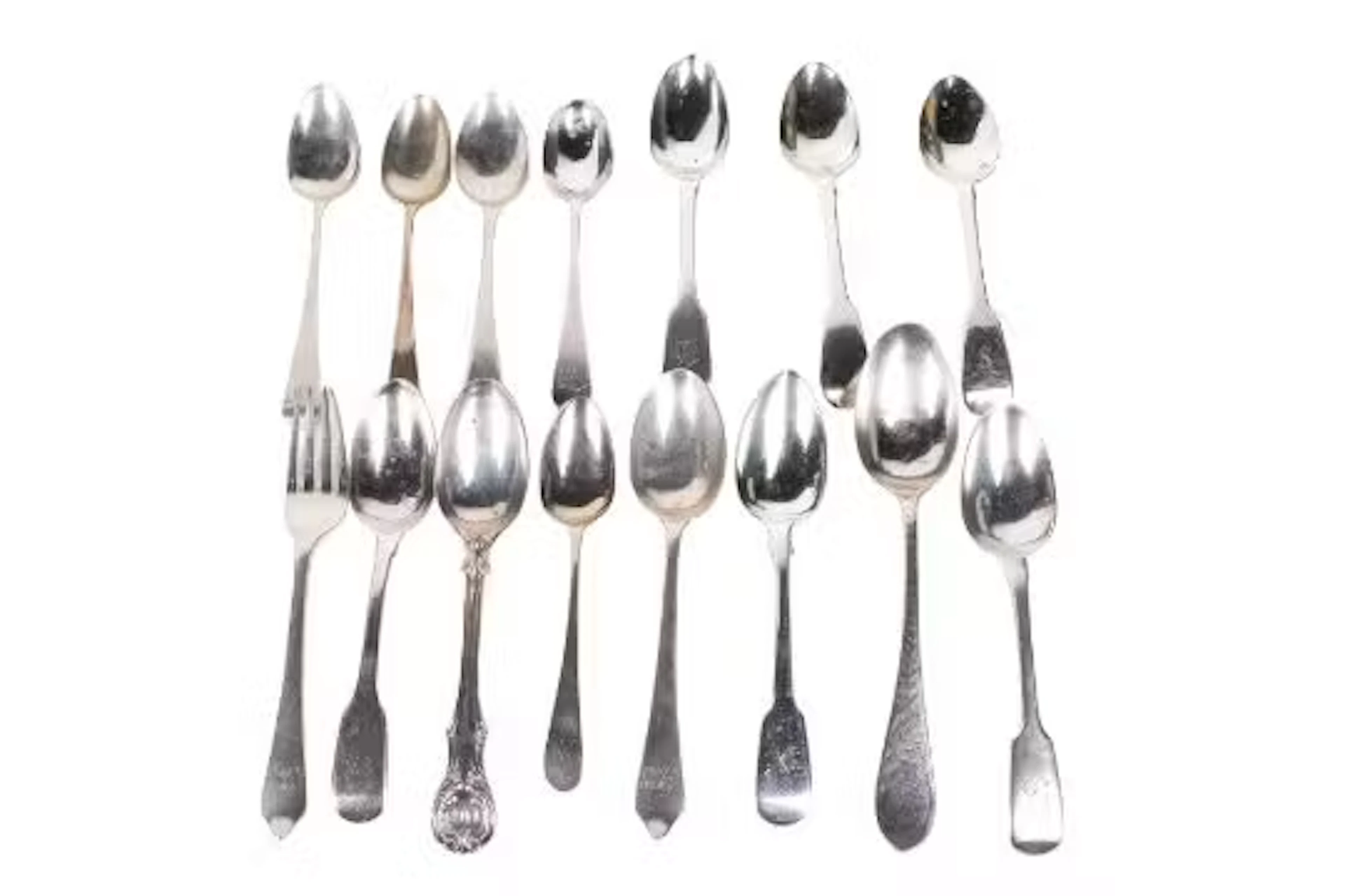 Fourteen Georgian and later silver teaspoons and a cake fork.