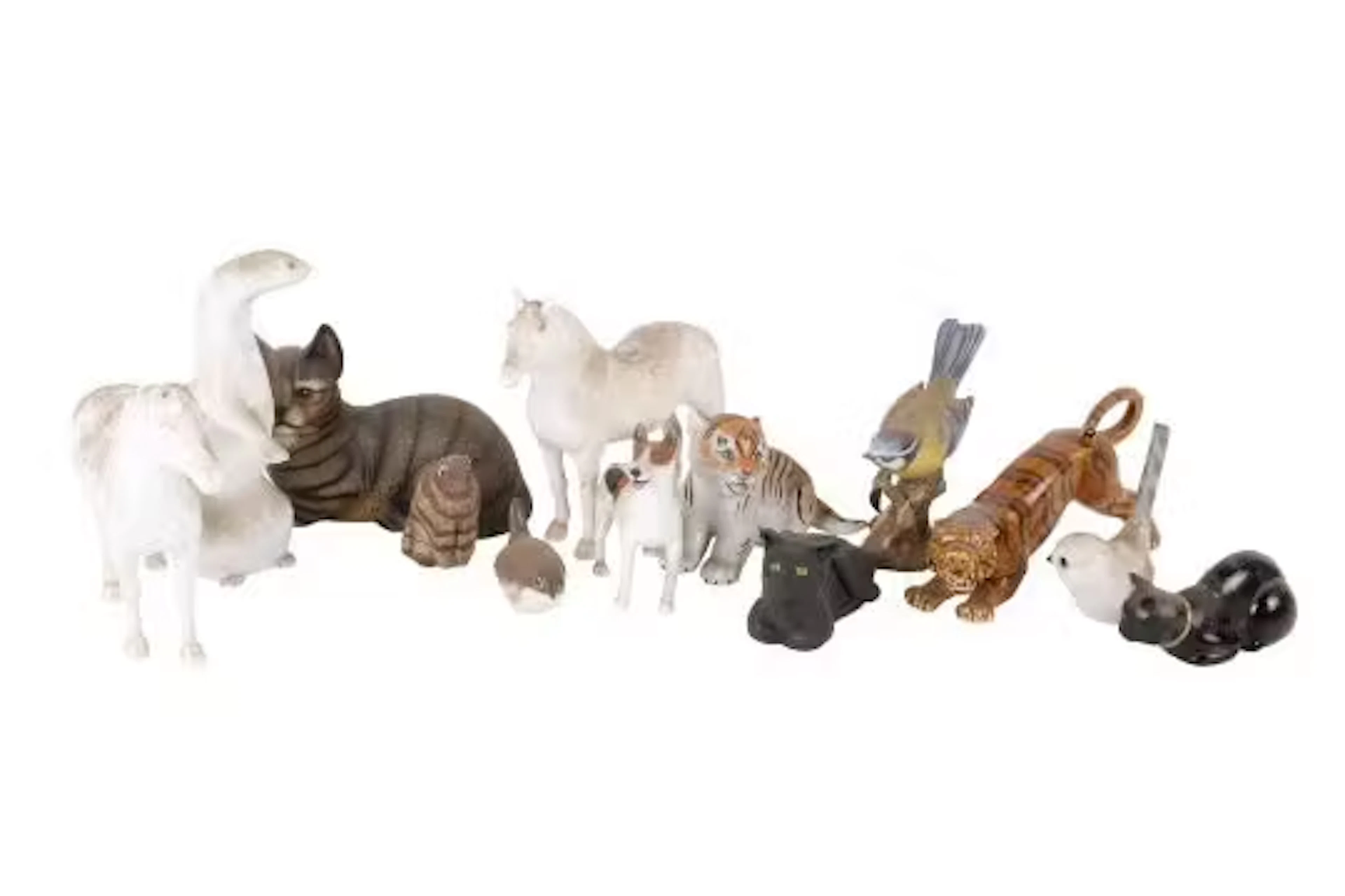 A small collection of assorted animal figurines. Including two Beswick