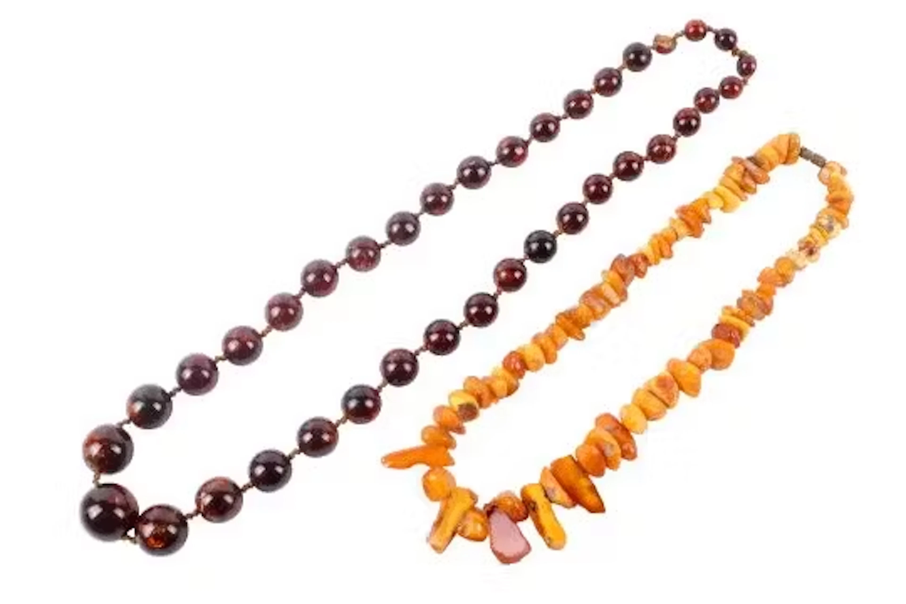 Two amber necklaces. The first with irregular butterscotch chips